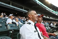 Lt. Col. Brian Dunn, G1, Assistant Chief of Staff, 85th U.S. Army Reserve Support Command, watches the Chicago White Sox Pride night game with his husband, Mike Graves, who served as a Torpedoman’s Mate on a U.S. Navy ballistic missile submarine.