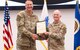 Lt. Col. Christian Hasbach receives the Product Manager Soldier Maneuver Sensors (PdM SMS) charter from Col. Anthony Gibbs, Project Manager Soldier Warrior, during a change of charter ceremony held on Fort Belvoir, June 22. Hasbach assumed leadership as product manager from Lt. Col. Melissa Johnson, accepting responsibility for the total life cycle management of SMS programs. PdM SMS is a product management office within the Program Executive Office, Soldier (PEO Soldier) portfolio, with a mission to rapidly deliver integrated sensors that enable the Soldier system to detect and engage first against all threats. (U.S. Army Photo by Jason Amadi, PEO Soldier Public Affairs)