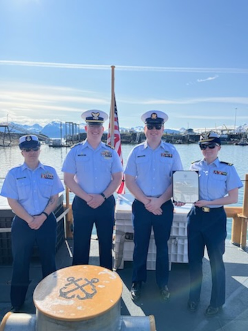 Chief Petty Officer Katie Schreiber (left), Lt. William Singletary, Petty Officer 1st Class Richard Moroge, and Lt.j.g. Leah Schweigert pose aboard Coast Guard Cutter Naushon (WPB 1311) June 3, 2023. Moroge was meritoriously advanced to petty officer 1st class for his outstanding contributions and accomplishments both on and off duty. Coast Guard courtesy photo.