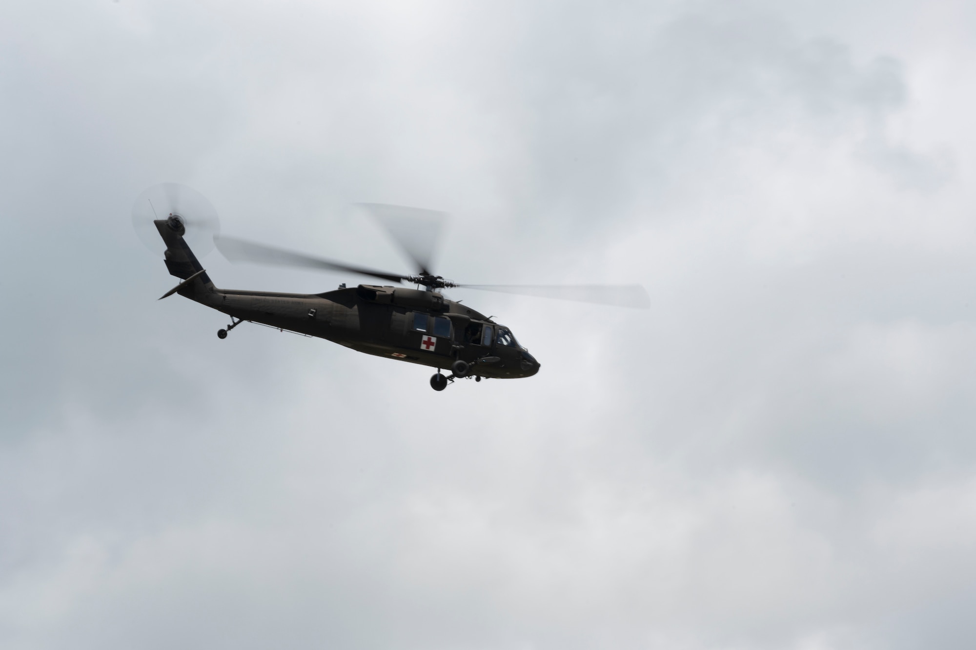 A UH-60 Black Hawk helicopter assigned to the Puerto Rico Army National Guard, flies overhead during the Advisor Edge exercise at Roosevelt Roads, Ceiba, Puerto Rico, June 8, 2023. Advisor Edge was a multi-unit exercise with the integration of government agencies, where participant units tested air advising skills and strengthened partnerships through unique challenges, allowing burden sharing in combat with partner nations. (U.S. Air National Guard photo by Master Sgt. Rafael D. Rosa)