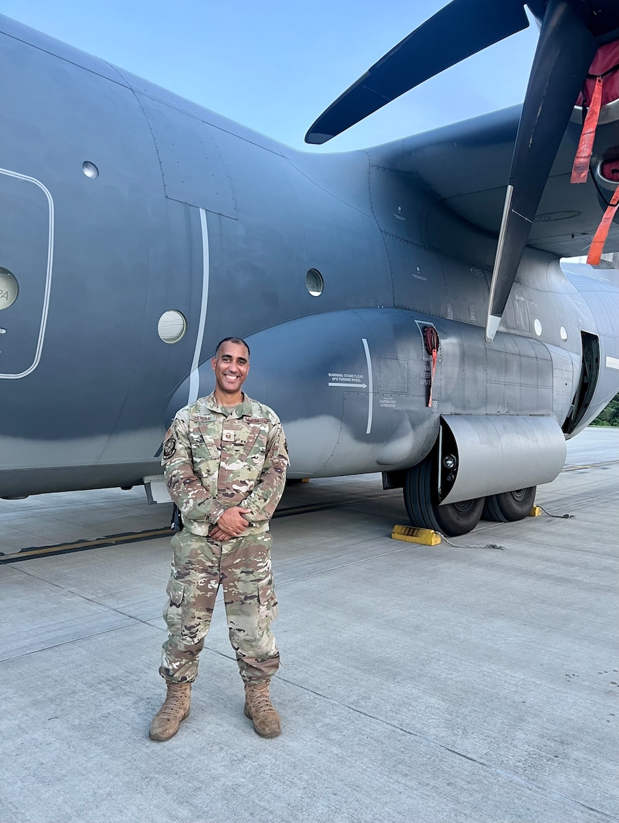 Airman standing in front of an aircraft