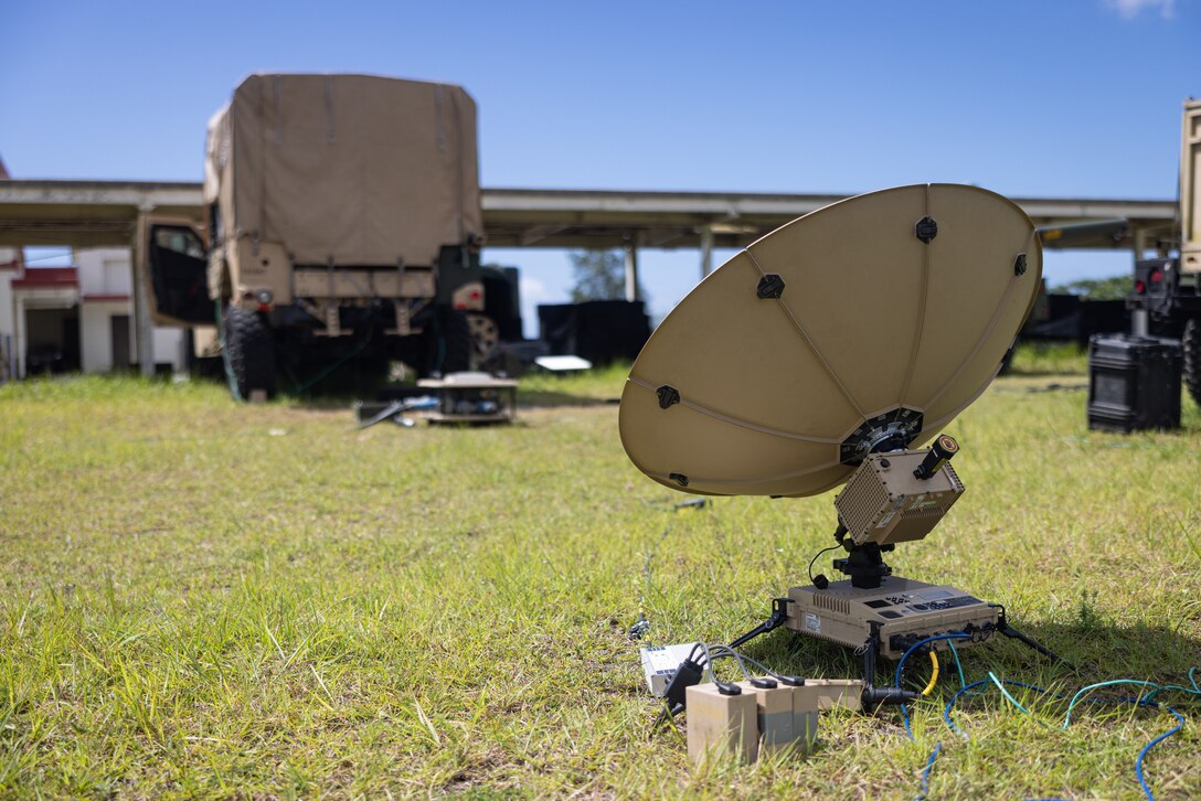 A Marine Corps Wideband System-Expeditionary Terminal is utilized during Exercise Vanguard on Camp Hansen, Okinawa, Japan, June 8, 2023. III MIG functions as the vanguard of III MEF, operating in the Indo-Pacific regions information environment, and supports Marine Air Ground Task Force operations with communications, intelligence, and supporting arms liaison capabilities.
