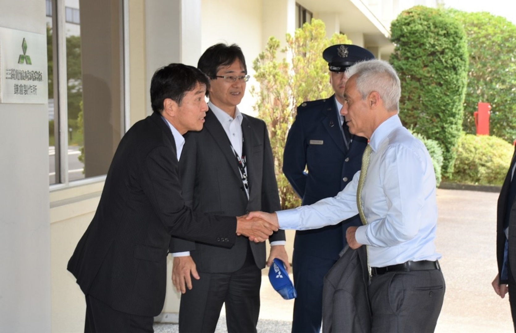 U.S. Ambassador to Japan, Rahm Emanuel, greets Mr. Yasuyuki Kasai, director general, Japanese National Space Policy Secretariat, Cabinet Office, Mr. Tomonori Sato, group president, Defense & Space Systems, Mitsubishi Electric Corporation, and Lt. Col. Brian Fredrickson, Quasi-Zenith Satellite System Hosted Payload (QZSS-HP) program manager, Space Systems Command, during a site visit to QZSS-HP in Japan.  Photo Credit: Provided by Government of Japan