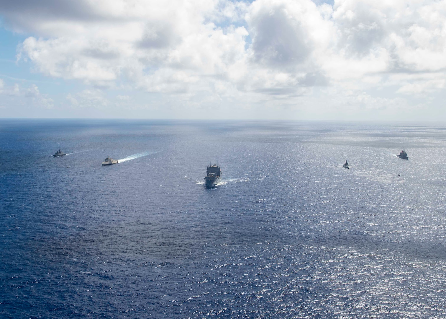 PHILIPPINE SEA (June 22, 2023) – The Independence-variant littoral combat ship USS Manchester (LCS 14) alongside Ticonderoga-class guided missile cruiser USS Shiloh (CG 67), Formidable-class stealth frigate RSS Tenacious (71), Independence-class littoral mission vessel RSS Dauntless (21), and dry cargo ammunition ship USNS Ceasar Chavez (T-AKE 14) transit the Philippine Sea during Exercise Pacific Griffin 2023, June 22. Pacific Griffin 2023 is the fourth iteration of the biennial maritime exercise between the U.S. and Republic of Singapore. Conducted in the waters near Guam, the two navies enhance combined maritime proficiency while strengthening relationships during two weeks of dynamic training evolutions ashore and at sea. Littoral Combat Ships are fast, optimally manned, mission-tailored surface combatants that operate in near-shore and open-ocean environments, winning against 21st-century coastal threats. Manchester, part of Destroyer Squadron 7, is on a rotational deployment operating in the U.S. 7th Fleet area of operations to enhance interoperability with Allies and partners and serve as a ready-response force in support of a free and open Indo-Pacific region.(U.S. Navy photo by Mass Communication Specialist 2nd Class Christopher Thomas)