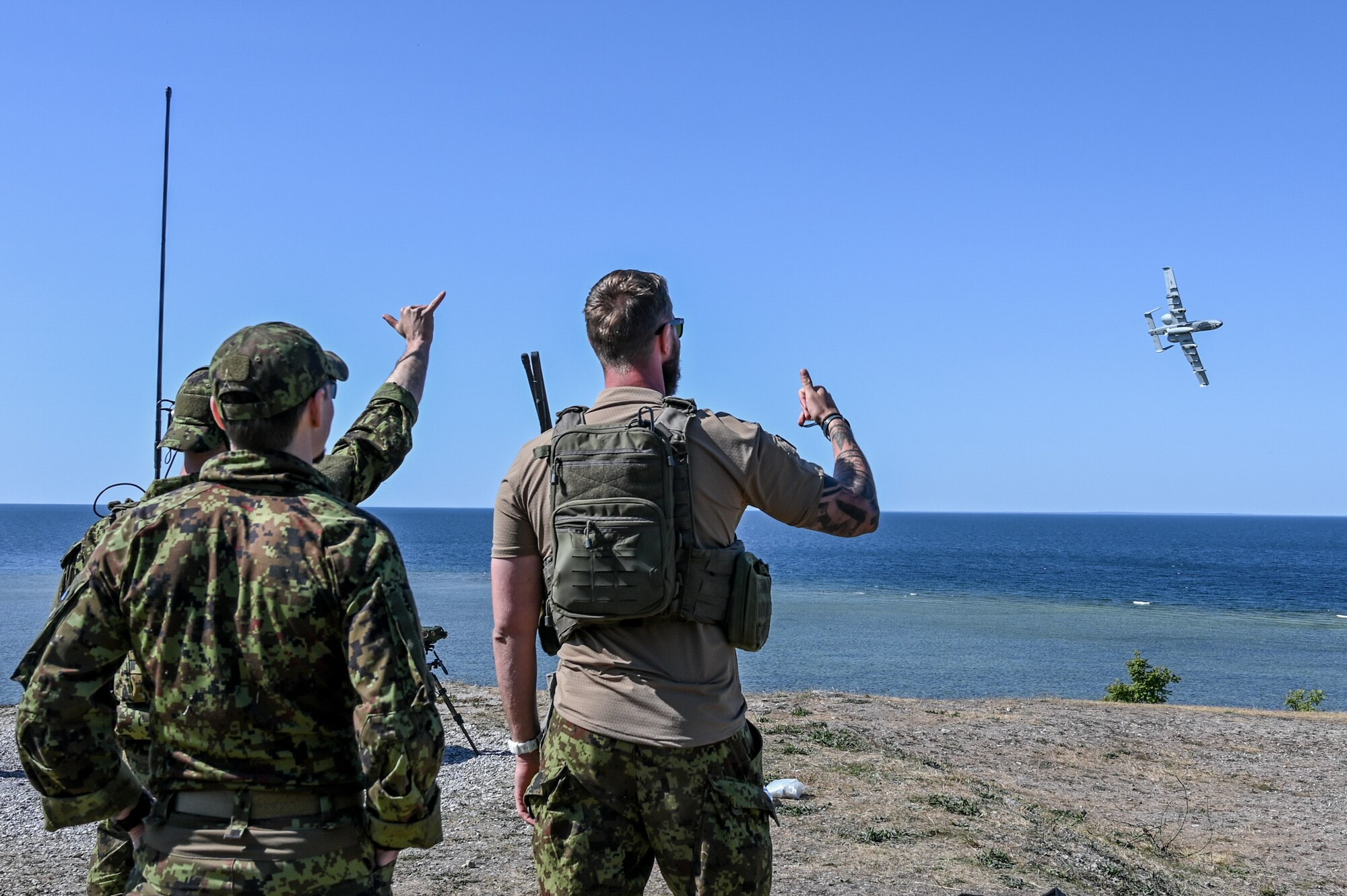 Estonian joint terminal attack controllers perform a panel check of a U.S. Air Force A-10C Thunderbolt II aircraft assigned to the 104th Fighter Squadron, 175th Wing, Maryland National Guard, after a live missile firing at a water range off the coast of Saaremaa, Estonia, June 12, 2023. Maryland and Estonia are celebrating 30 years of partnership through the Department of Defense National Guard Bureau State Partnership Program.