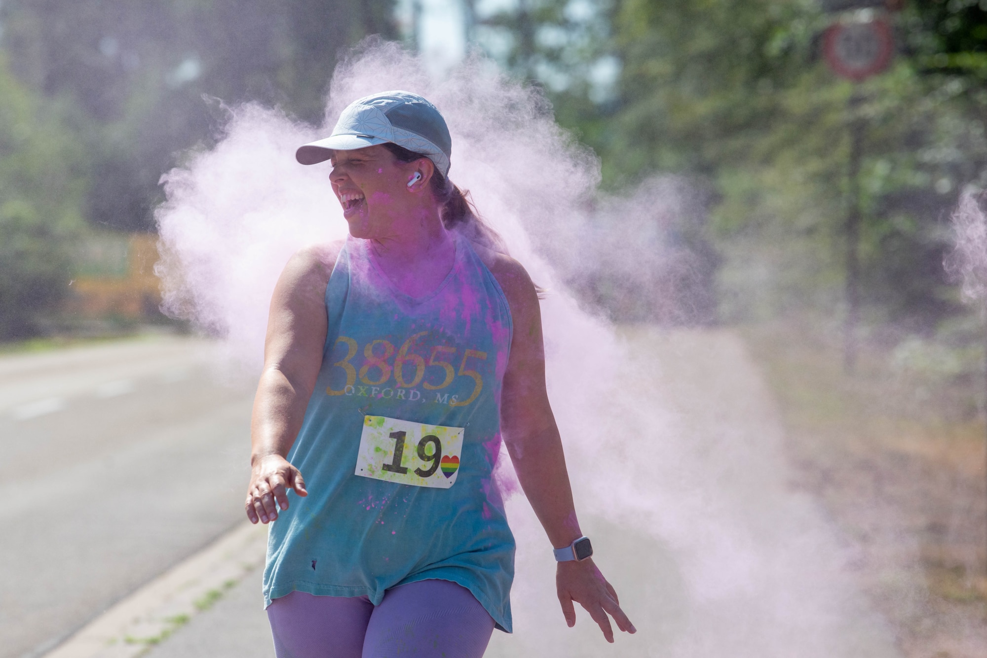 Woman runs during a color run