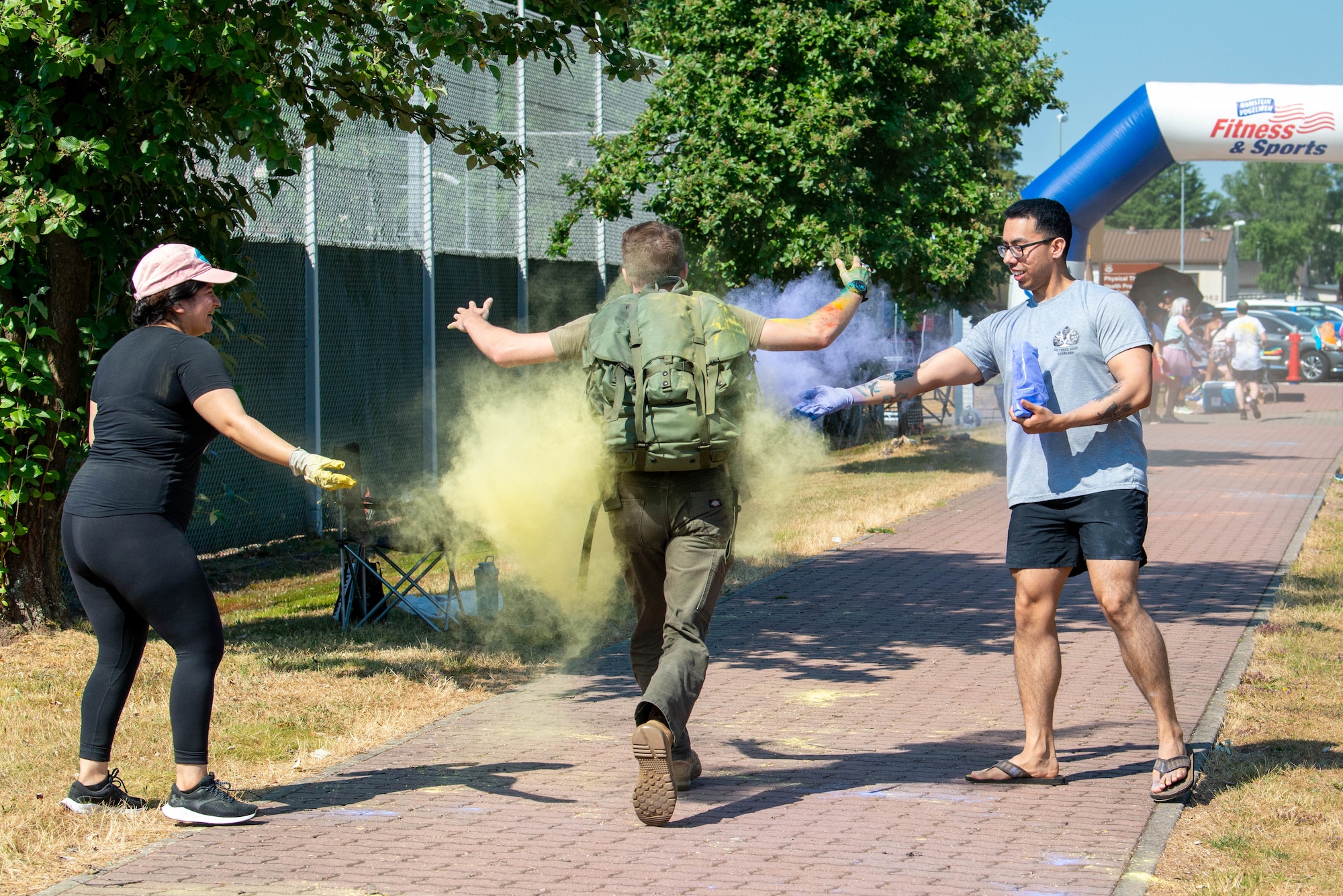 Airmen has color thrown at him during a color run