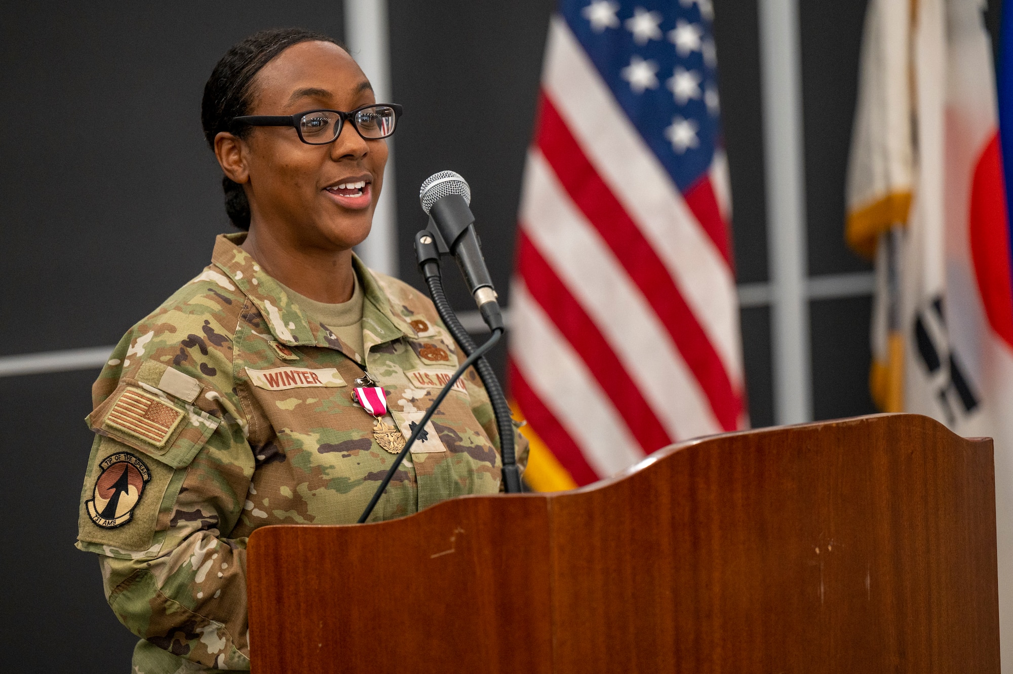 U.S. Air Force Lt. Col. Sabrina Winter, 731st Air Mobility Squadron outgoing commander, provides a speech during a change of command at Osan Air Base, Republic of Korea, June 23, 2023. During the ceremony, Lt. Col. Luke Berreckman took command of the 731st AMS.  (U.S. Air Force photo by Senior Airman Aaron Edwards)