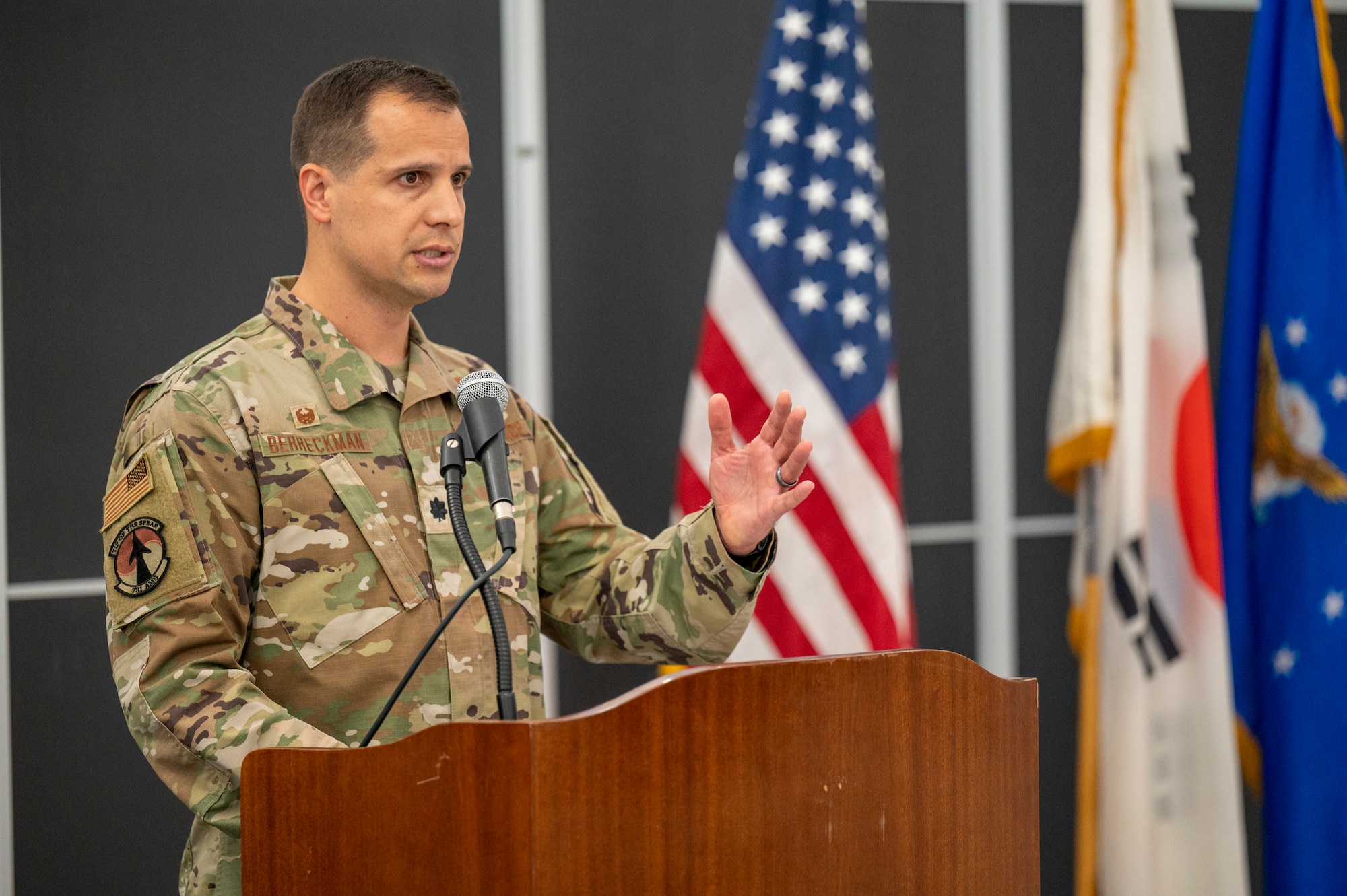 U.S. Air Force Lt. Col. Luke Berreckman, 731st Air Mobility Squadron incoming commander, gives his first speech to his squadron during a change of command ceremony at Osan Air Base, Republic of Korea, June 23, 2023. Change of command ceremonies are time-honored traditions deeply-rooted in American military history.  (U.S. Air Force photo by Senior Airman Aaron Edwards)