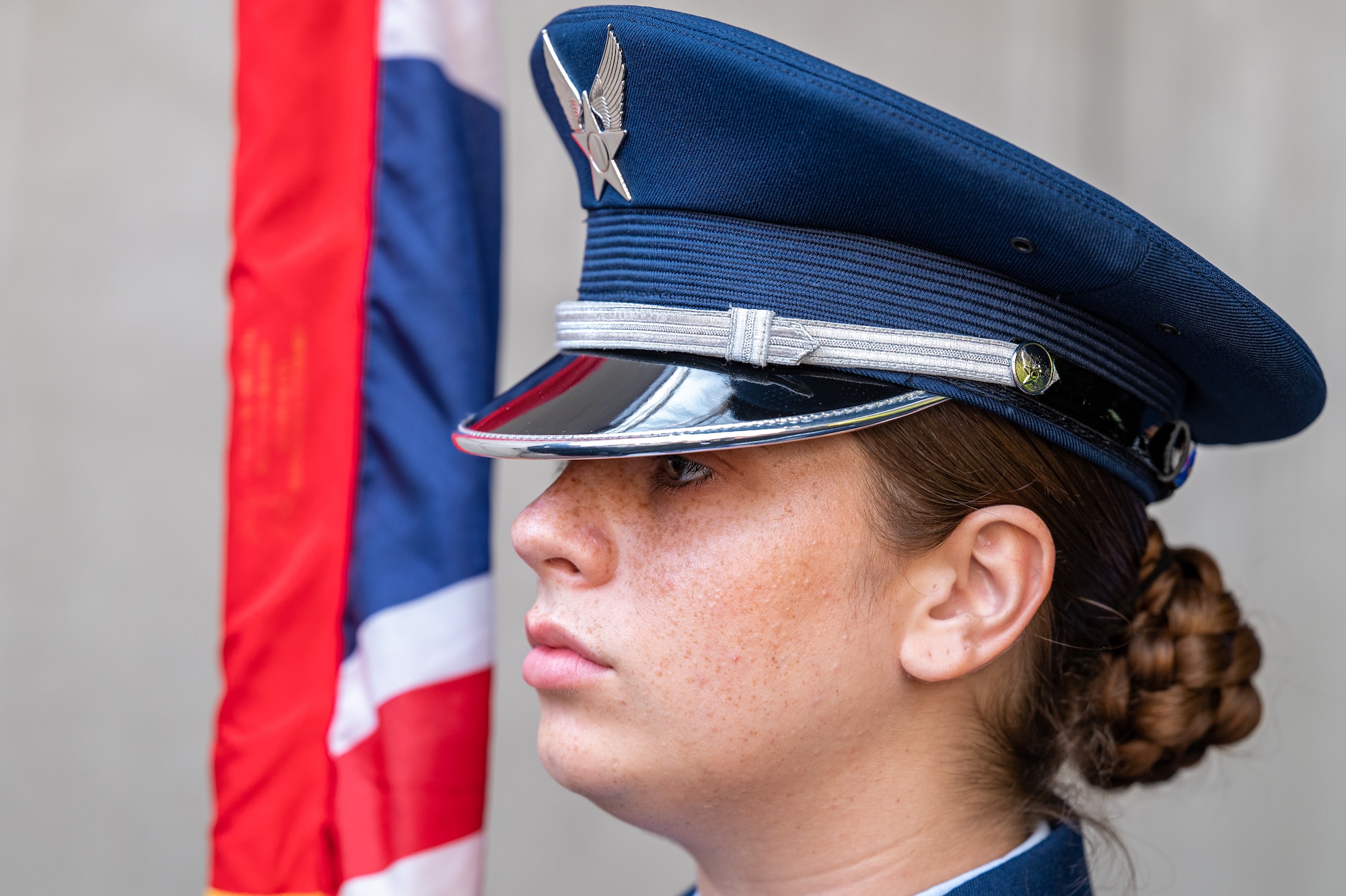 U.S. Air Force Airman 1st Class Miranda Dickinson, 100th Air Refueling Wing honor guardsman, prepares to present the colors during the pre-game ceremony at London Stadium, England, June 25, 2023.
