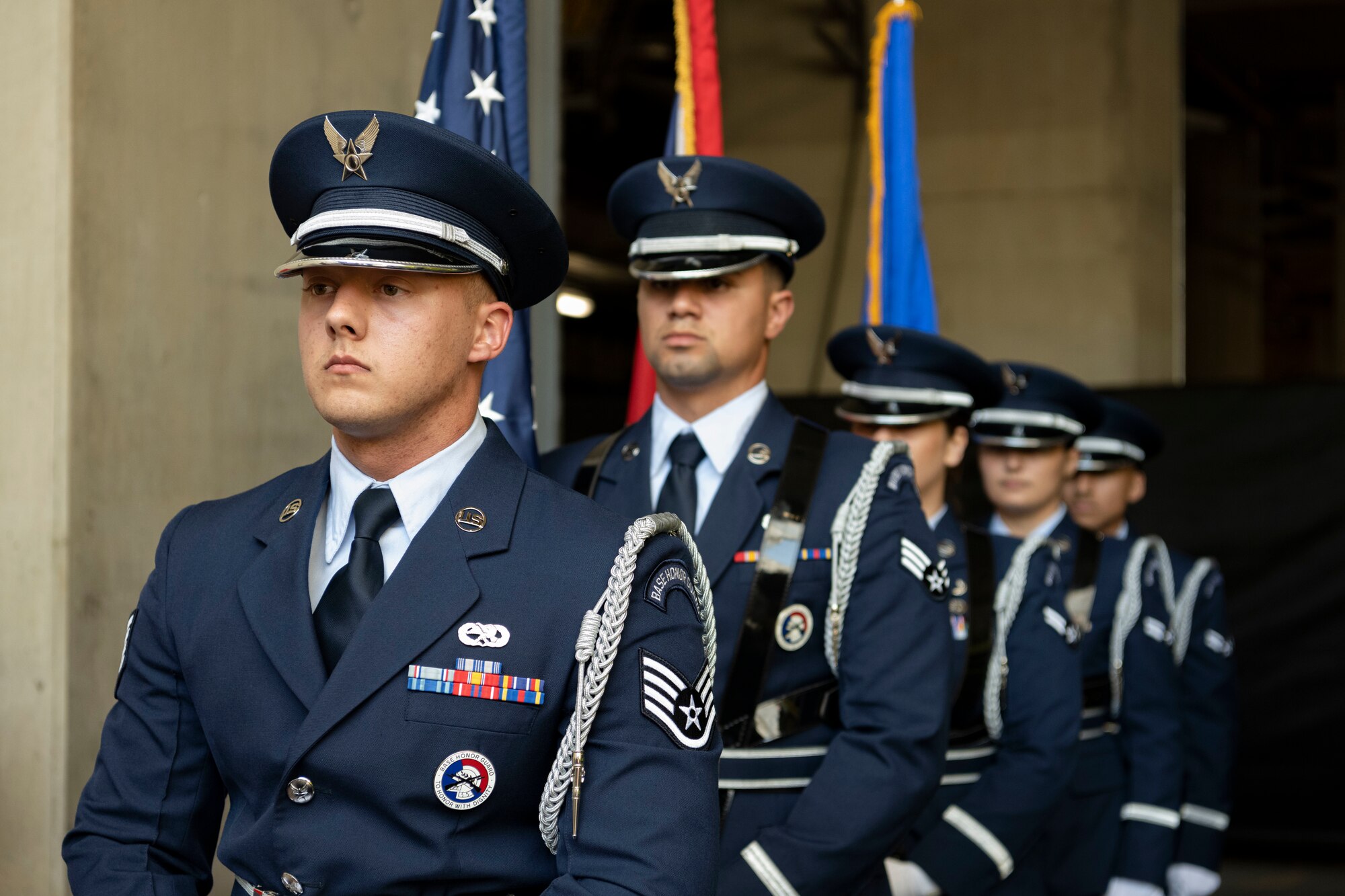 U.S. Air Force Airmen assigned to the 100th Air Refueling Wing honor guard, prepare to march onto the field for the presentation of the colors during the pre-game ceremony at London Stadium, England, June 25, 2023.
