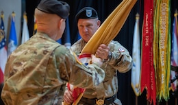 Lt. Gen. Patrick Frank, commanding general, U.S. Army Central (Left), passes the 1st TSC unit colors to Brig. Gen Eric P. Shirley, incoming commanding general, 1st Theater Sustainment Command (Right), during a change of command ceremony on Fort Knox, Kentucky, June 23, 2023. Shirley assumes command of the 1st TSC from Maj. Gen. Michel M. Russell Sr., outgoing commanding general, who led the team since July 13, 2021.