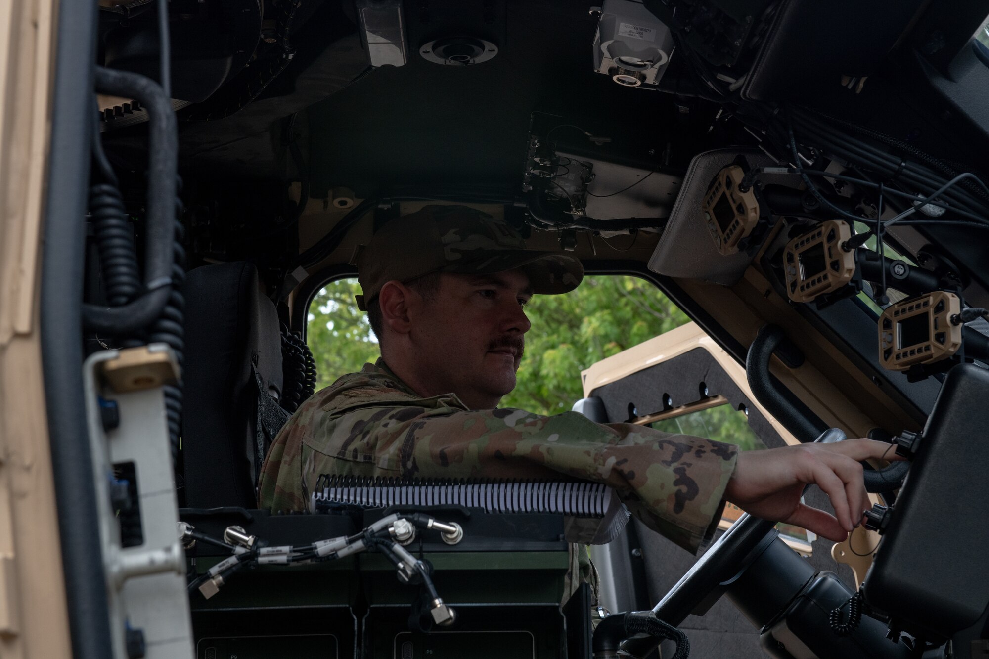 U.S. Air Force Capt. Michael Sanders, 48th Logistics Readiness Squadron vehicle maintenance flight commander, performs electronic checks in Joint Light Tactical Vehicle at RAF Lakenheath, England, June 22, 2023. The JLTVs, which will replace Humvees, will be used for daily operations in the vicinity of the flightline, providing increased operational security for the Liberty Wing. (U.S. Air Force photo by Airman Delanie Brown)