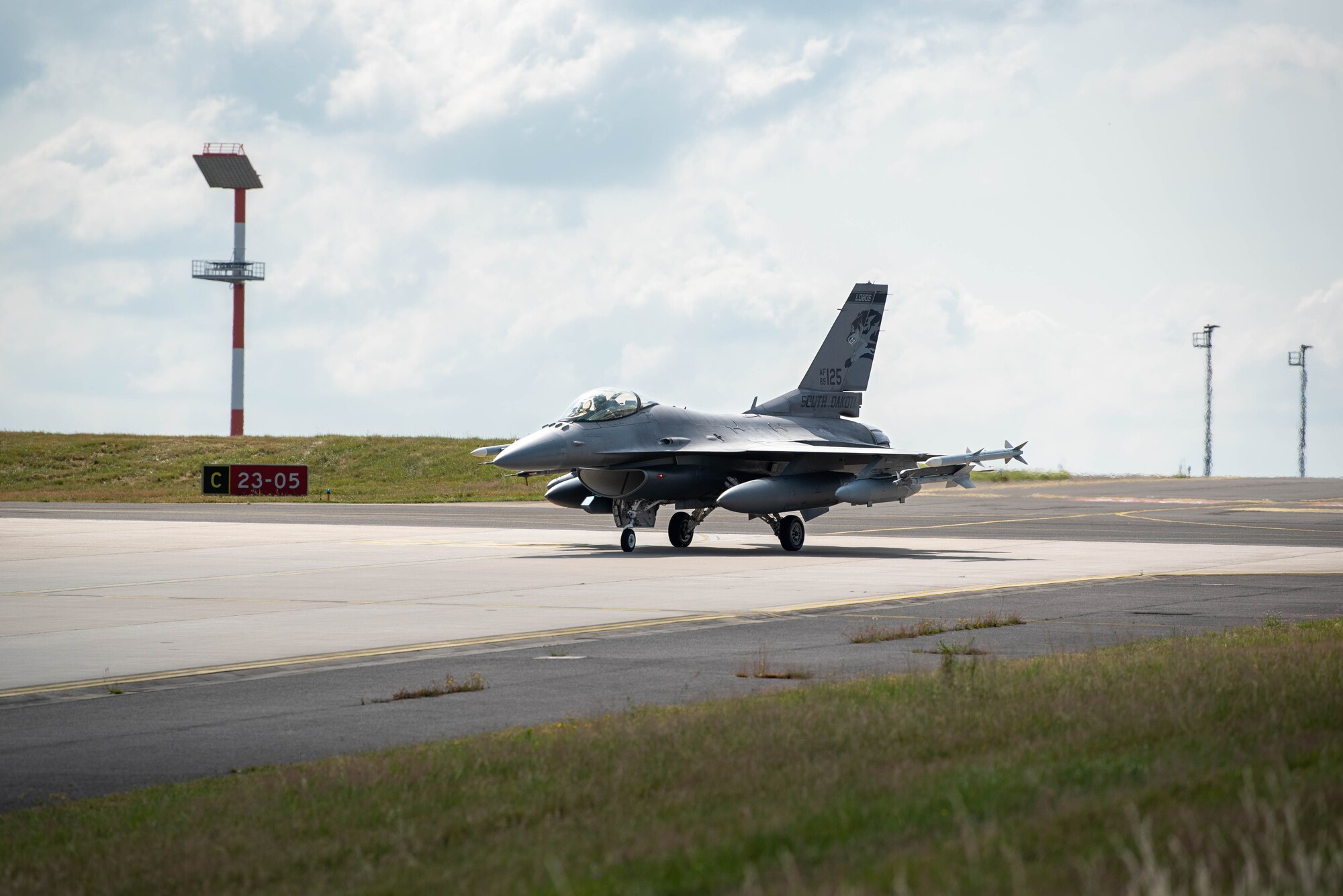 A U.S. F-16 Fighting Falcon fighter aircraft  taxis the runway at Spangdahlem Air Base, Germany.