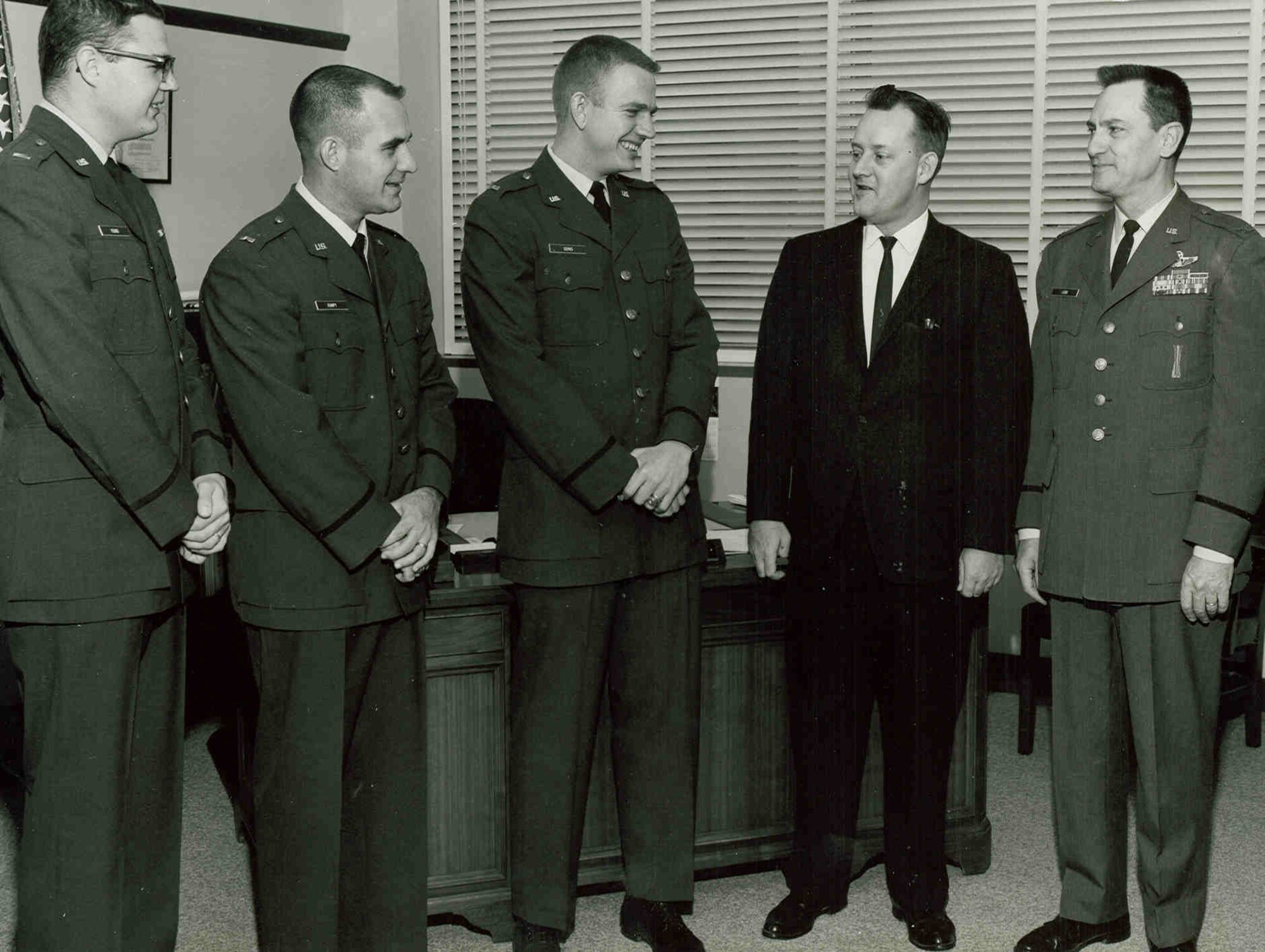 John Rampy, then a first lieutenant in the U.S. Air Force, second from left, is congratulated in 1965 by then-Arnold Engineering Development Complex vice commander Col. James Cobb, right, and Dr. Robert L. Young, then-University of Tennessee Space Institute deputy director for Educational Programs, second from right. Rampy, along with 1st Lt. Jimmie Young, left, and 1st Lt. Elmer E. Goins Jr. were the first three Air Force officers to receive graduate degrees from UTSI. Rampy took a job with Arnold in 1974 and eventually became the executive director of AEDC. Rampy, recognized as an AEDC Fellow in 1996, passed away on June 15, 2023. (U.S. Air Force photo)