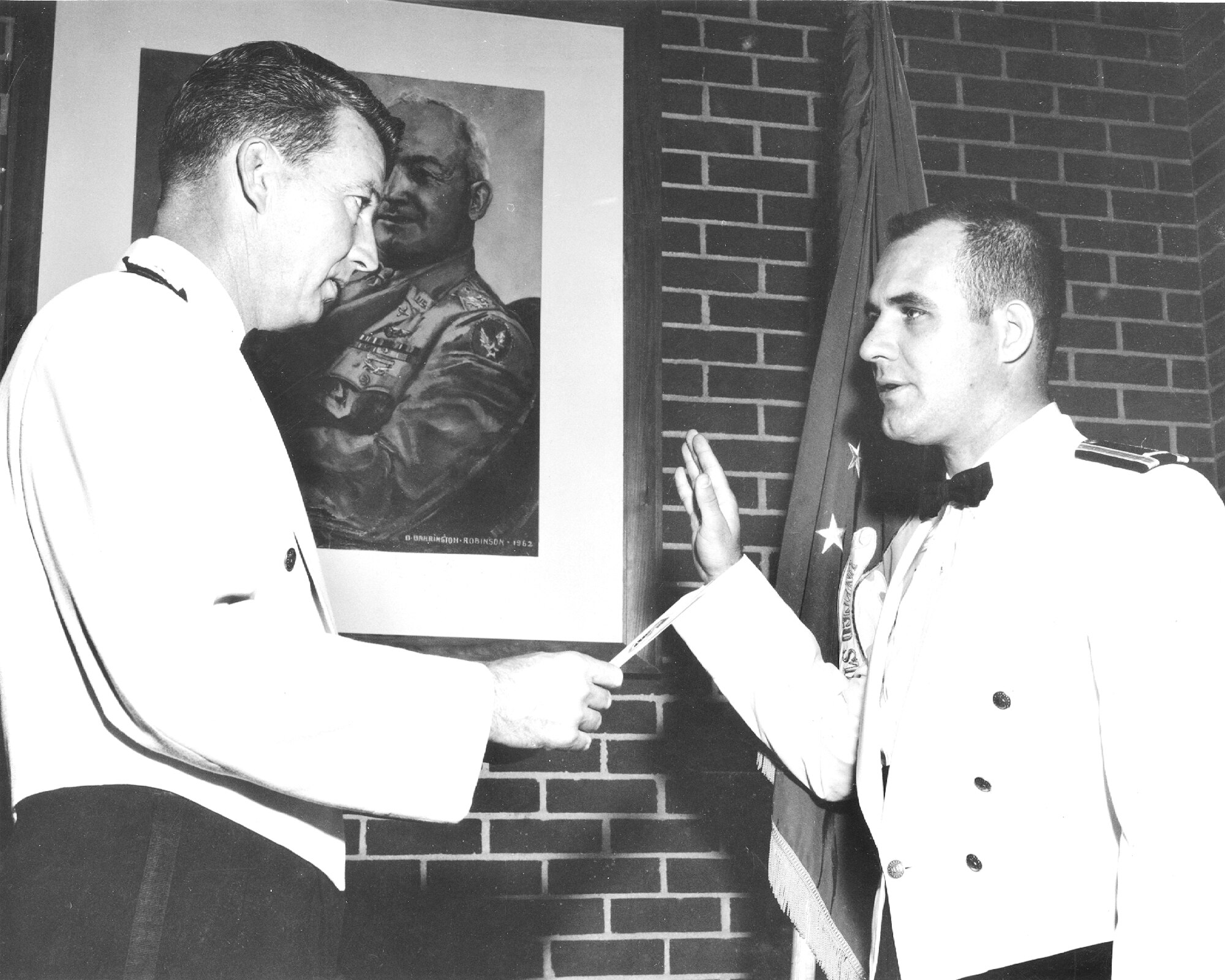 John Rampy, right, is sworn in as a regular Air Force officer by Gen. Bernard Schriever, then-commander of Air Force Systems Command, in the 1960s. Rampy took a job at Arnold in 1974 and eventually became the executive director of Arnold Engineering Development Complex. Rampy, recognized as an AEDC Fellow in 1996, passed away on June 15, 2023. (U.S. Air Force photo)