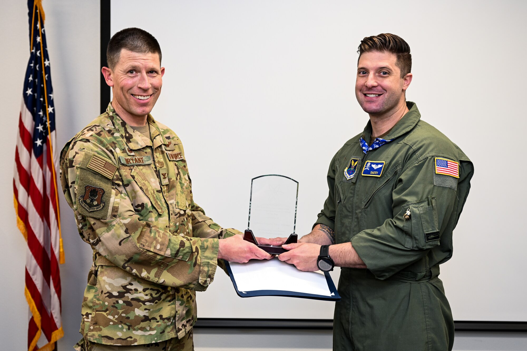 Col. Philip Bryant, 582nd Helicopter Group commander, recognizes Tech. Sgt. Ethan Williams, 37th Helicopter Squadron flight engineer, as the U.S. Air Force UH-1N Instructor Flight Engineer Reservist of the Year on F.E. Warren Air Force Base, Wyoming, June 9, 2023. Williams made significant contributions to the field of aerial nuclear security and aviation training. (U.S. Air Force photo by Joseph Coslett Jr.)