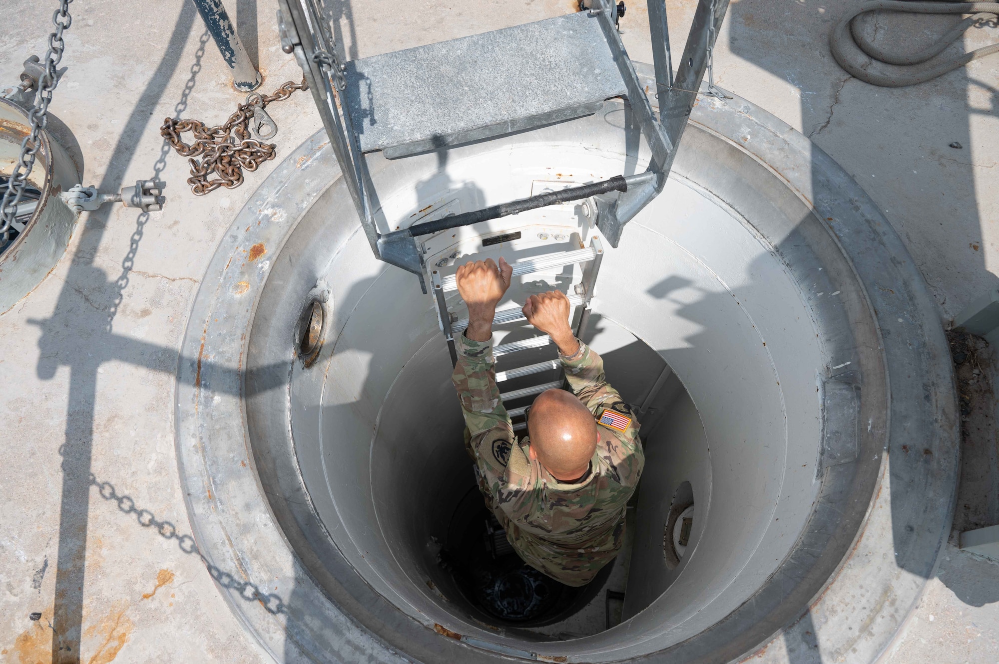 U.S. Army Lt. Gen. A.C. Roper, deputy commander of U.S. Northern Command, climbs down the ladder of the Bravo-02 launch facility near La Grange, Wyoming, June 13, 2023. Roper visited the 90th Missile Wing to gain a hands-on perspective of how the intercontinental ballistic missile mission supports homeland defense. (U.S. Air Force photo by Senior Airman Sarah Post)