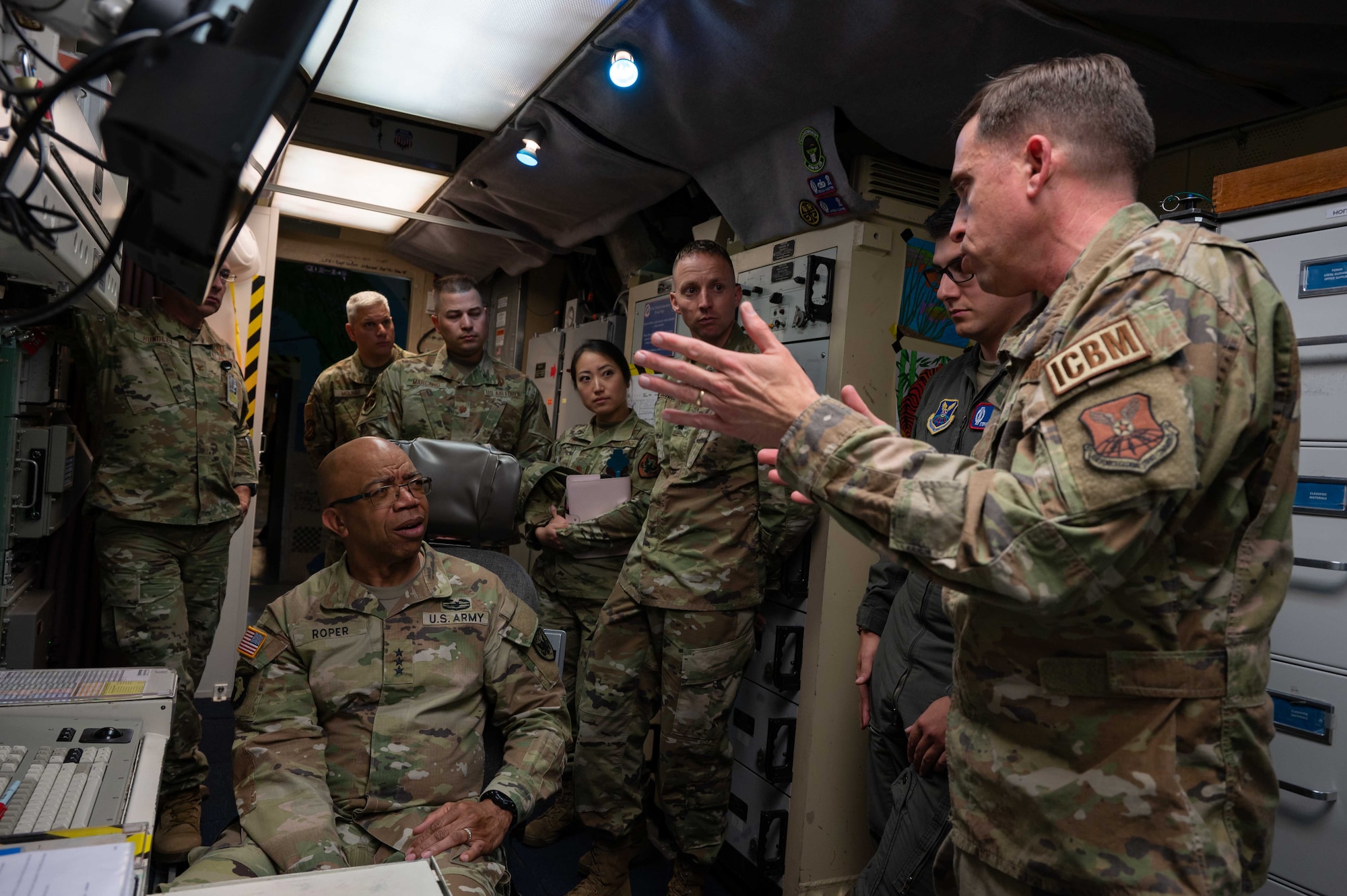U.S. Air Force Lt. Col. Jared Bishop, 319th Missile Squadron commander, briefs U.S. Army Lt. Gen. A.C. Roper, deputy commander of U.S. Northern Command, on launch control center operation at the Bravo-01 missile alert facility near Bushnell, Nebraska, June 13, 2023. The 90th Missile Wing provides defense support to civil authorities for emergency response when tasked under USNORTHCOM. (U.S. Air Force photo by Senior Airman Sarah Post)