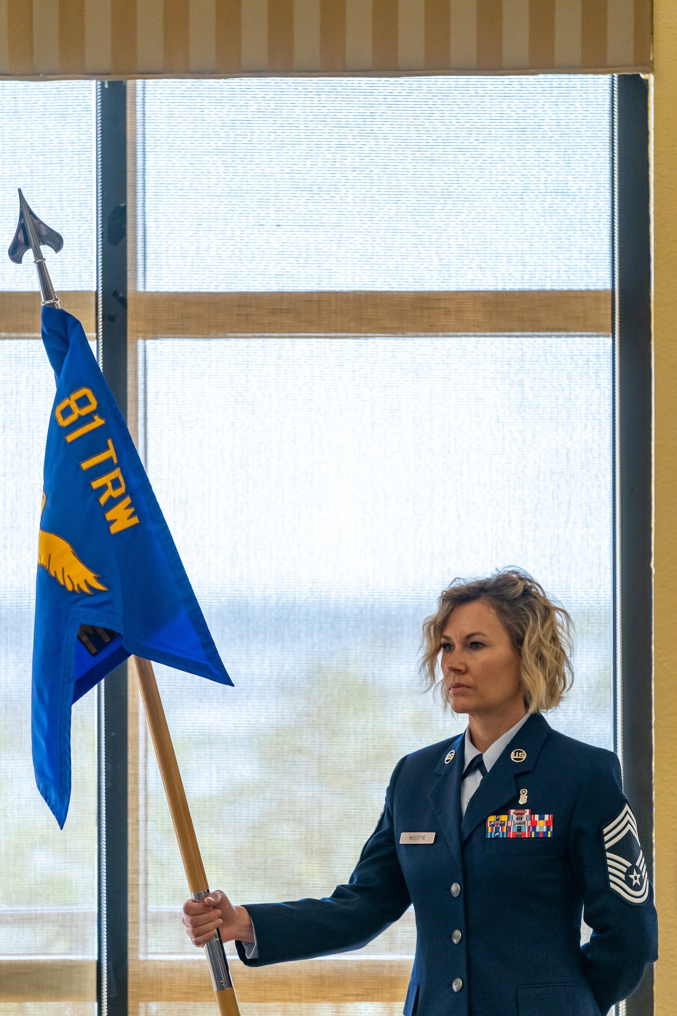 U.S. Air Force Chief Master Sgt. Jacey McDuffie, 81st Medical Group senior enlisted leader, stands at parade rest before the 81st MDG change of command ceremony at Keesler Air Force Base, Mississippi, June 23, 2023.
