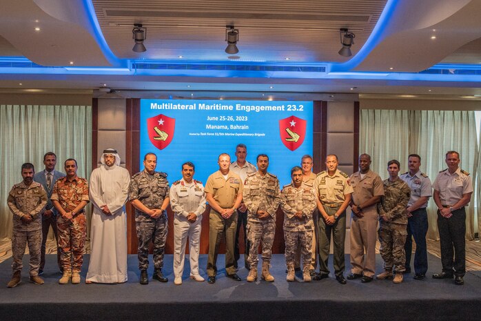 U.S. Marine Brig. Gen. Matthew S. Reid, Commanding General of Naval Amphibious Force, Task Force 51/5th Marine Expeditionary Brigade (TF 51/5) and Senior National Representatives pose for a group photo during the Multilateral Maritime Engagement 23.2 conference in Bahrain, June 26, 2023. MME is a Task Force 51/5-led event that fosters multilateral communication, security cooperation, and future collaborative training between partners in the U.S. Central Command area of responsibility.