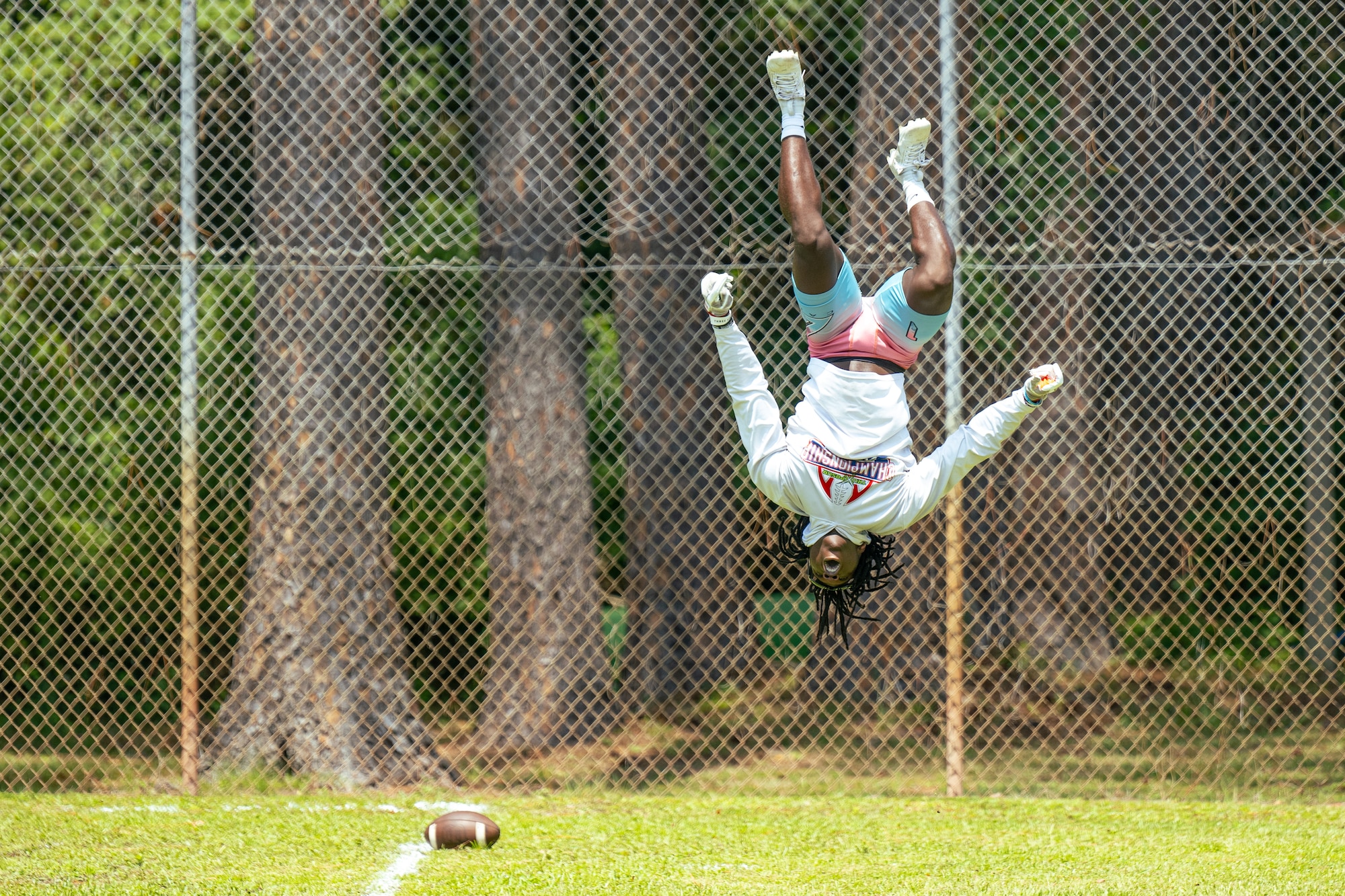 Players with C3 Elite National Team and a military team participate in the Air Commando Invitational, a 7-on-7 football tournament, at Hurlburt Field, Florida June 24, 2023. The C3 Elite National Team won the tournament after a championship game against Destin High School. (U.S. Air Force photo by Airman 1st Class Bailey Wyman)
