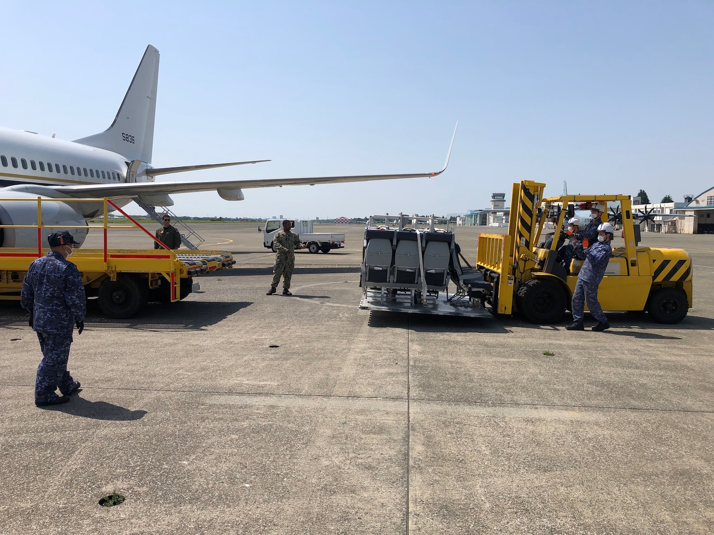 VR-57 Conducts First-Ever Deployed C-40 Re-rig with Support from JMSDF