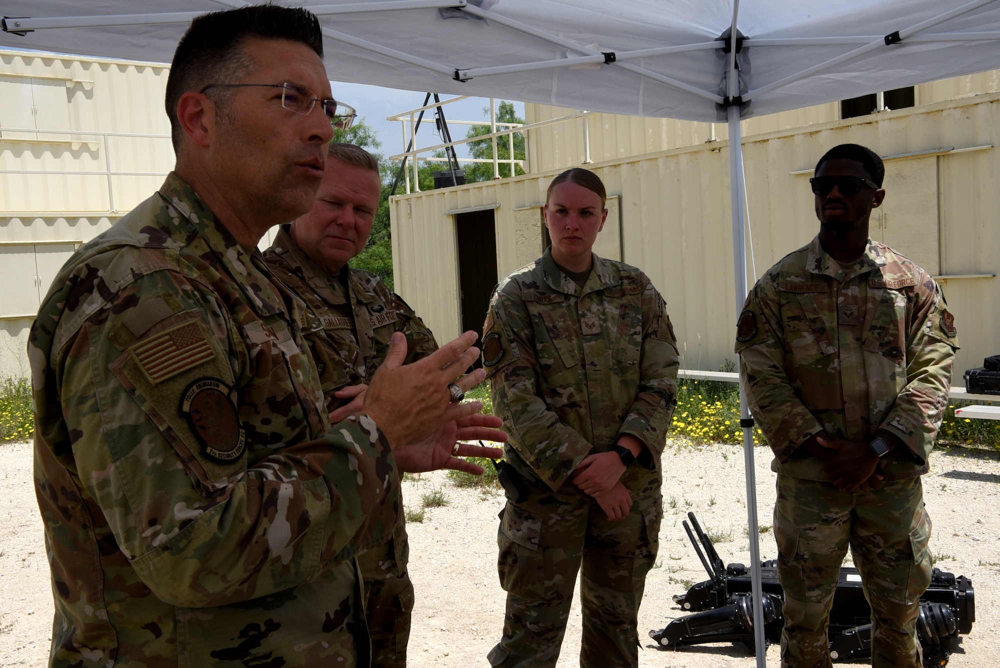 U.S. Air Force Brig. Gen. Thomas Sherman, Security Forces director, speaks to 7th Security Forces Squadron Airmen about the new technology at Dyess Air Force Base, Texas, June 15, 2023. Sherman visited Dyess to present the 7th SFS with the Air Force Best Medium Sized Security Forces Squadron Award along with seeing new innovations including the robotic dog, a new GPS system, upgraded flack vests and more. (U.S. Air Force photo by Senior Airman Sophia Robello)