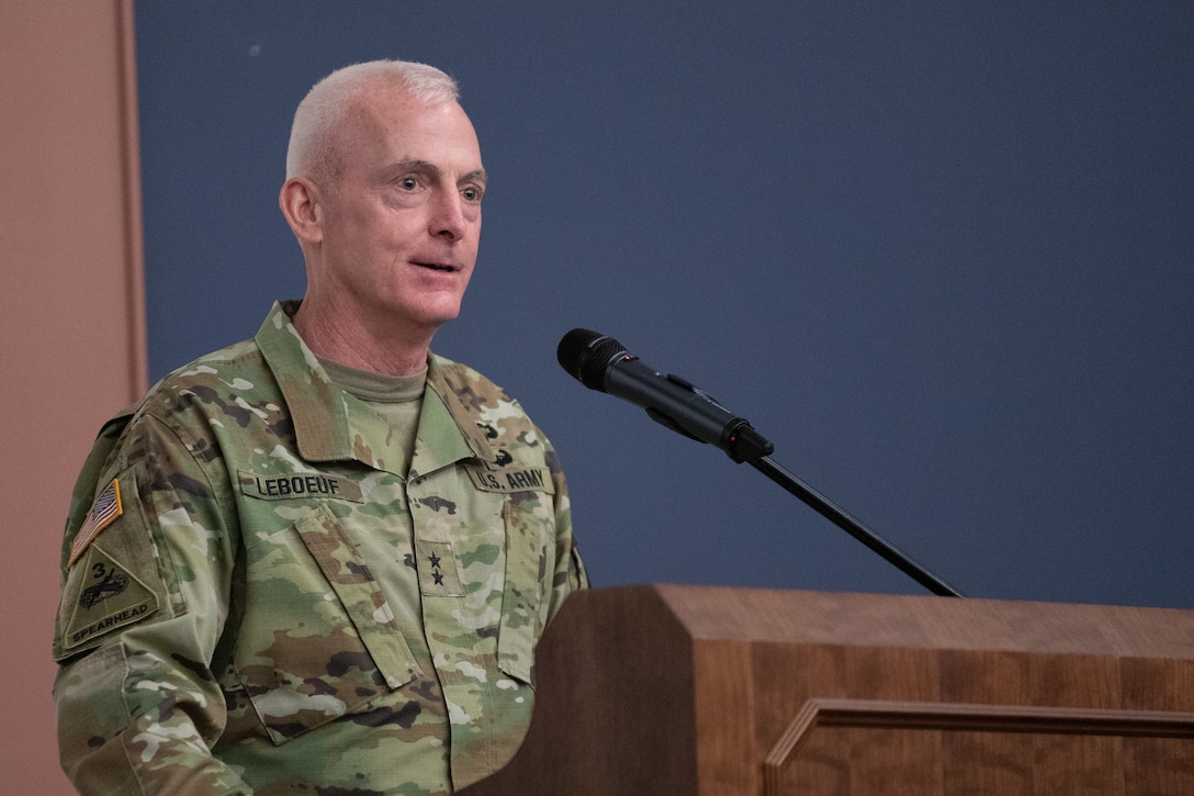 Maj. Gen. Eugene LeBoeuf, Deputy Commanding General, United States Army Reserve Command, addresses Soldiers and guests from behind a podium.