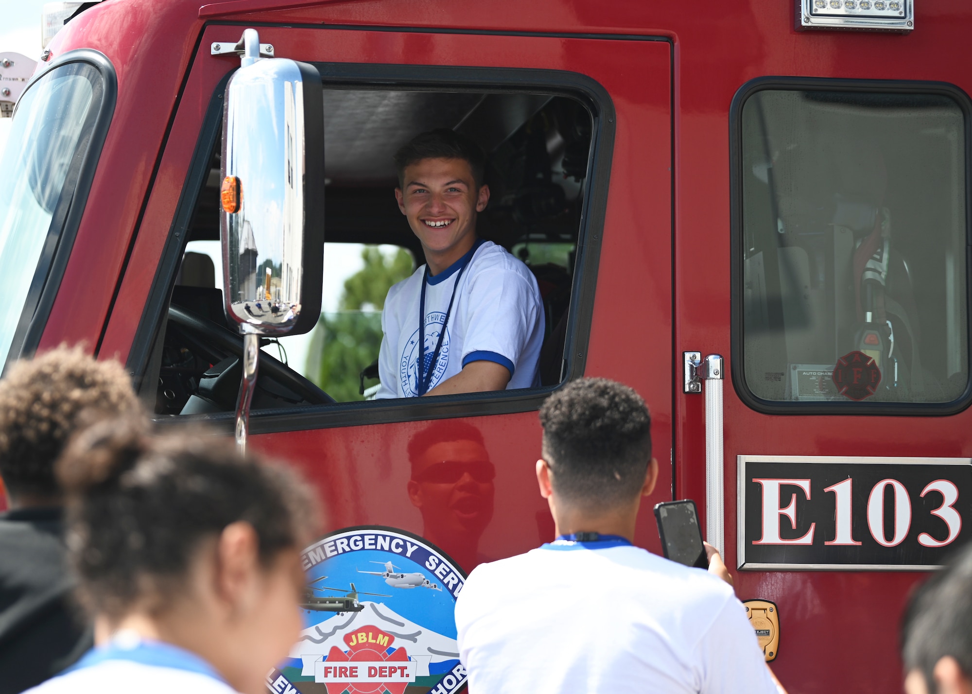 A student with the North West Youth Leadership Conference sits in a fire engine at Joint Base Lewis-McChord, Washington, June 26, 2023. The NWYLC is a four-day leadership camp for high school students hosted by the Military Order of the World Wars. As a Veteran’s Service Organization, the MOWW provides opportunities to support veterans and patriotic youth education. (U.S. Air Force photo by Senior Airman Callie Norton)