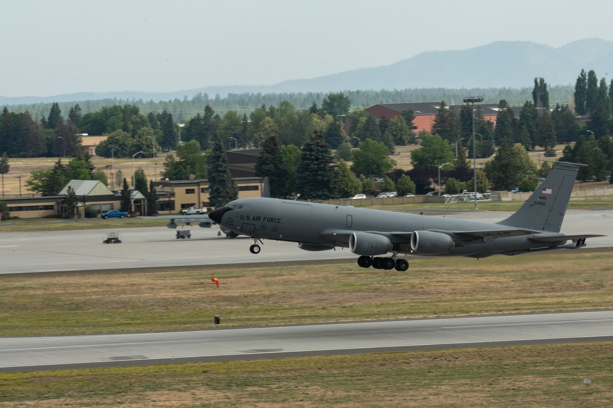 A KC-135 Stratotanker takes off from the flightline as part of Operation Centennial Contact at Fairchild Air Force Base, Washington, June 27, 2023. The movement, which included stops at Yellowstone National Park, Mount Rushmore and Glacier National Park, was part of Air Mobility Command’s celebration of 100 years air refueling operations and demonstrated the 92nd Air Refueling Wing’s global reach capabilities. Since its inception in 1923, Air refueling has become a crucial component of military and civilian aviation operations around the world by extending the range and endurance of aircraft and enabling them to complete missions that would otherwise be impossible or require multiple stops. As a result, this capability is essential for strategic and tactical operations, as well as humanitarian relief efforts in support of AMC, U.S. Transportation Command and Department of Defense priorities. (U.S. Air Force photo by Airman 1st Class Clare Werner)