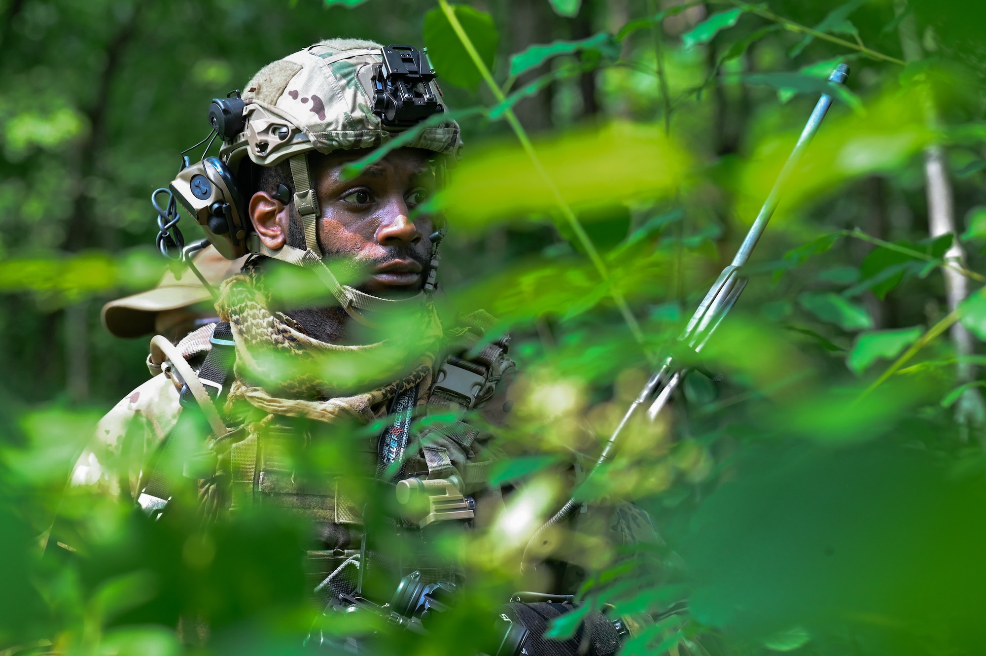 Tech. Sgt. Austin Wright, a Defender assigned to the 301st Security Forces Squadron, Carswell Field, Naval Air Station Joint Reserve Base Fort Worth, Texas, navigates his way through the woods during a training exercise on June 15, 2023, at Camp James A. Garfield Joint Military Training Center, Ohio.