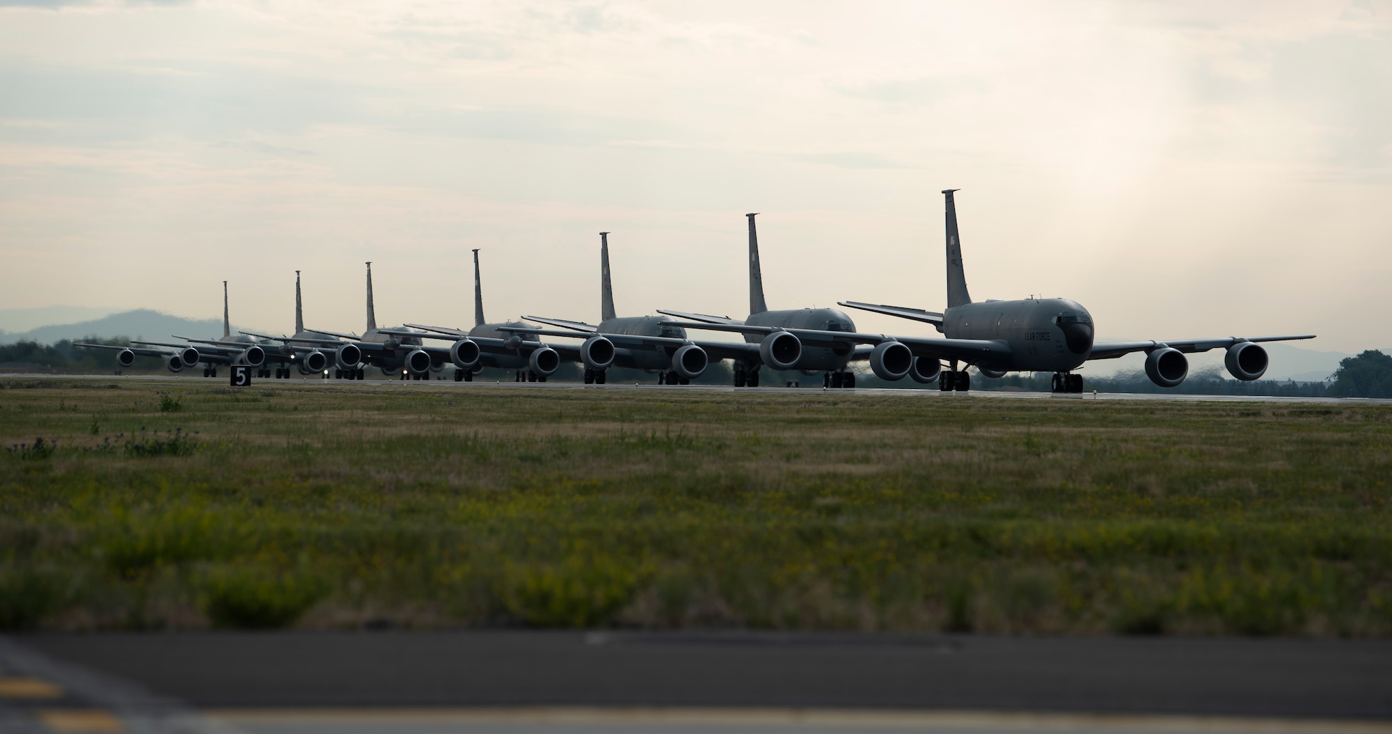 KC-135 Stratotankers assigned to the 92nd Air Refueling Wing and 141st Air Refueling Wing taxi into position before takeoff as part of Operation Centennial Contact at Fairchild Air force Base, Washington, June 27, 2023. The movement, which included stops at Yellowstone National Park, Mount Rushmore and Glacier National Park, was part of Air Mobility Command’s celebration of 100 years air refueling operations and demonstrated the 92nd Air Refueling Wing’s global reach capabilities. Since its inception in 1923, Air refueling has become a crucial component of military and civilian aviation operations around the world by extending the range and endurance of aircraft and enabling them to complete missions that would otherwise be impossible or require multiple stops. As a result, this capability is essential for strategic and tactical operations, as well as humanitarian relief efforts in support of AMC, U.S. Transportation Command and Department of Defense priorities. (U.S. Air Force photo by Tech. Sgt. Michael Brown)