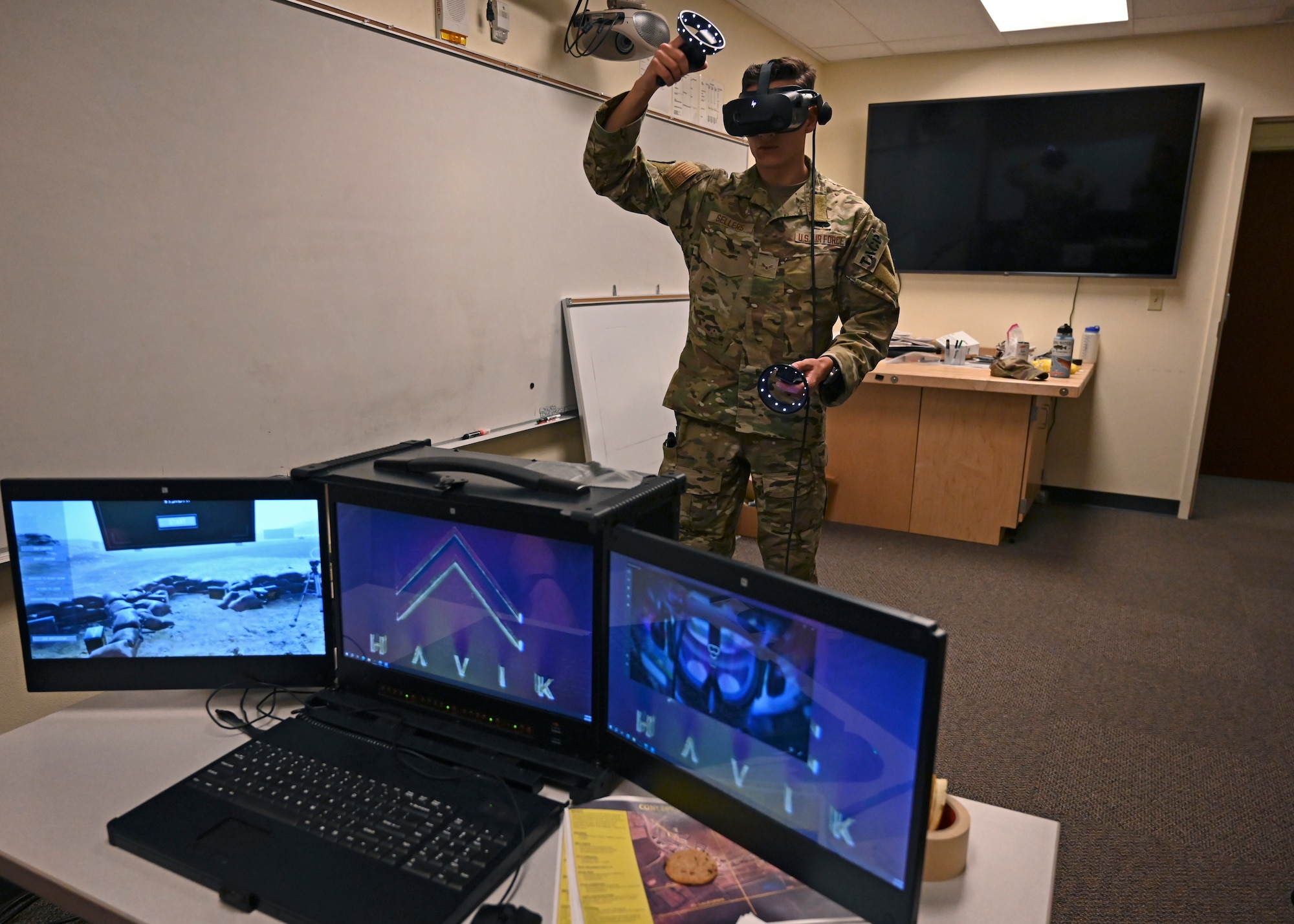 U.S. Air Force Airman 1st Class Lukas Sellers, cyber transport technician with the 627th Communication Squadron, operates a Havik Simulator at Joint Base Lewis-McChord, Washington, June 8, 2023. The 5th Air Support Operation Squadron will use the new portable simulator to practice mission requirements on site, prior to navigating real world missions. (U.S. Air Force Senior Airman Callie Norton)