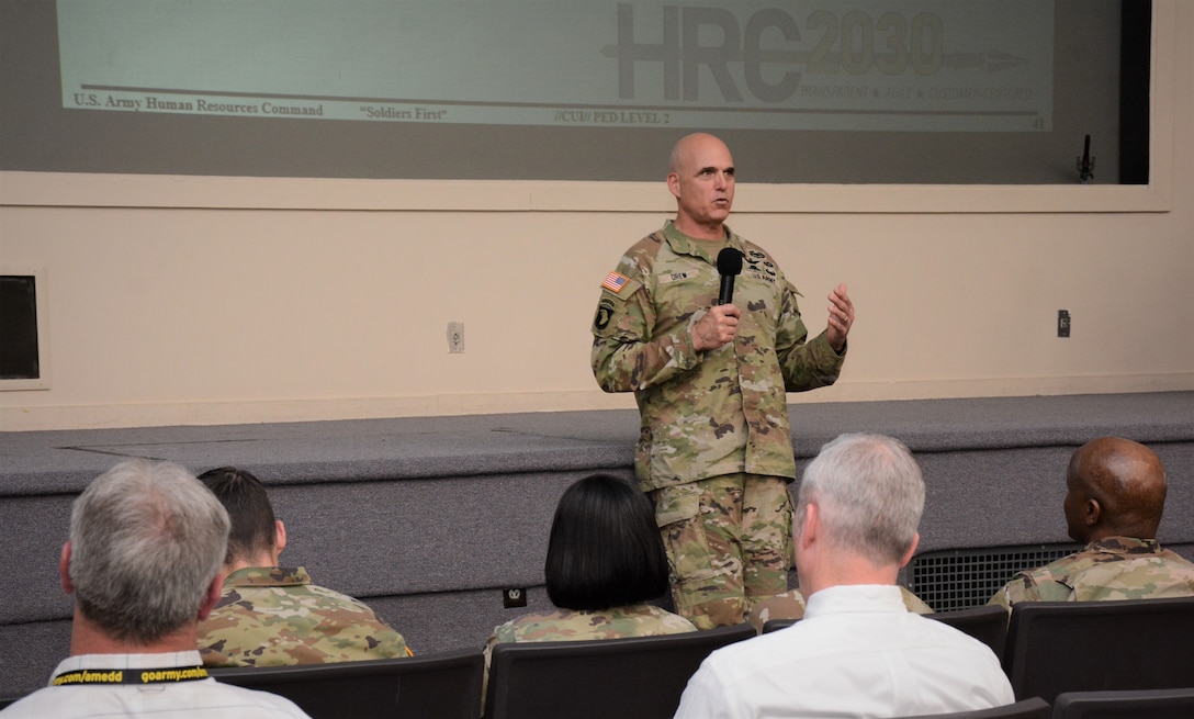 Maj. Gen. Thomas Drew, commanding general of U.S. Army Human Resources Command, recently addresses Soldiers and staff during a workforce townhall at Fort Knox, Ky. During the town hall Drew provided updates about the HRC 2030 initiative and fielded questions from the workforce. In keeping with its mission of conducting world-class service that enables the Army to deploy, fight and win the nation’s wars, HRC is working to establish a well-trained workforce that is transparent in communication and agile in its responsiveness while remaining customer-centered in supporting the Soldier in each issue, request and interaction. (U.S. Army photo by Fonda Bock, U.S. Army Human Resources Command)