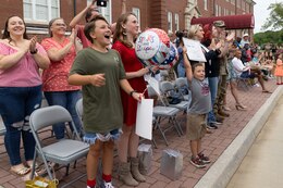 Staff. Sgt Michael Kadlec's two daughters and son, Belle, Lucy and Owens are rushed with excitement when the bus their dad is on arrives during a redeployment ceremony in front of Fowler Hall on Fort Knox, Kentucky, June 23, 2023.