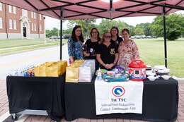 Members of the 1st Theater sustainment Command Soldier and Family Readiness Group provided food and drinks for the redeploying Soldiers of the 18th Financial Support Center during a redeployment ceremony in front of Fowler Hall on Fort Knox, Kentucky, June 23, 2023.