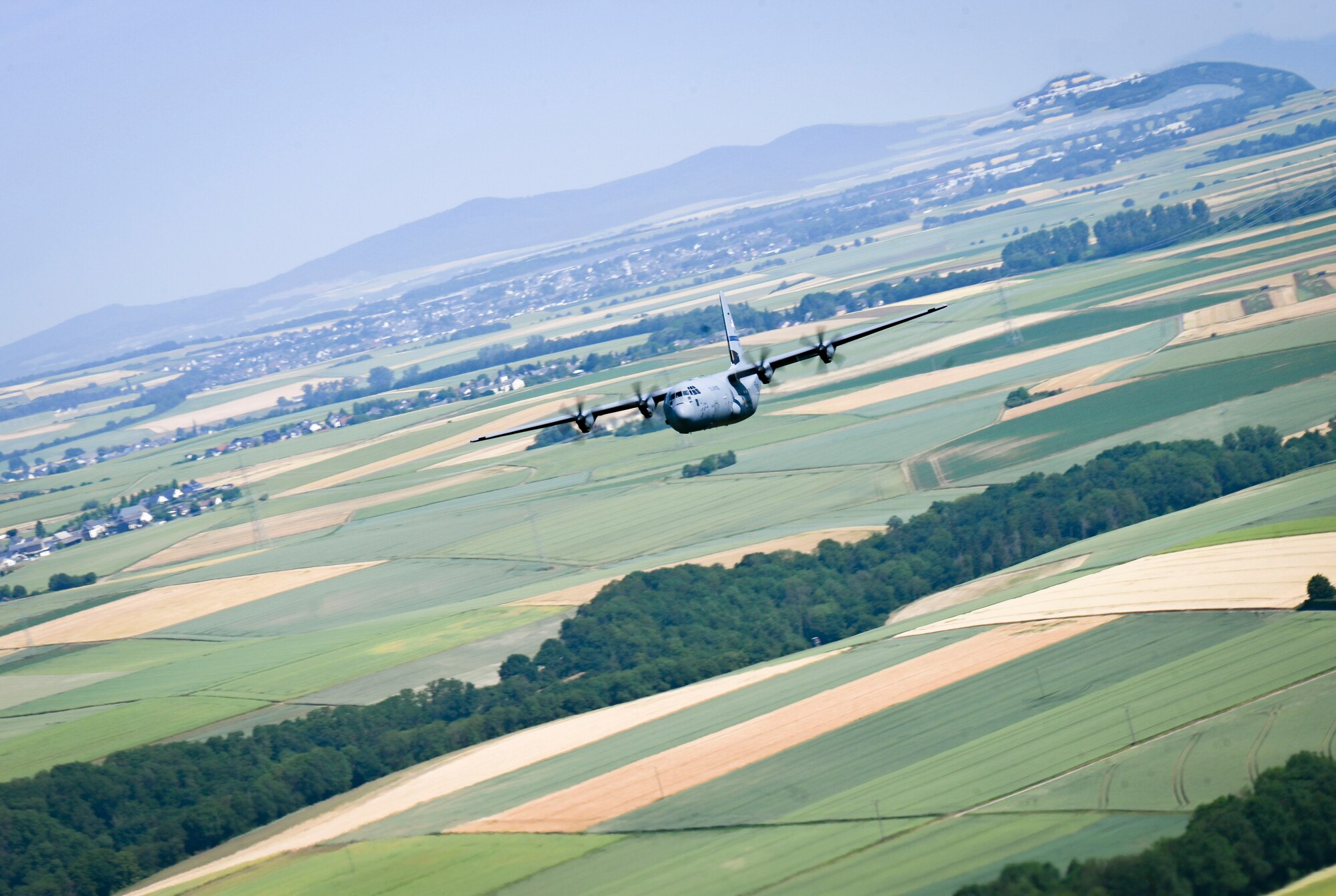 C-130J Flying over German countryside.