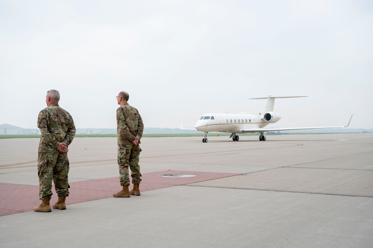 Col. Christopher Meeker, 88th Air Base Wing and Installation commander (left), and Gen. Duke Richardson, Air Force Materiel Command commander, await the arrival of Secretary of the Air Force Frank Kendall on the flightline at Wright-Patterson Air Force Base, Ohio, June 27, 2023.