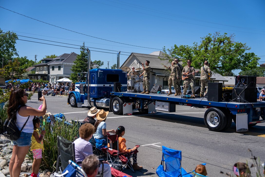 Mobility performs on a float in the Dixon May Fair parade