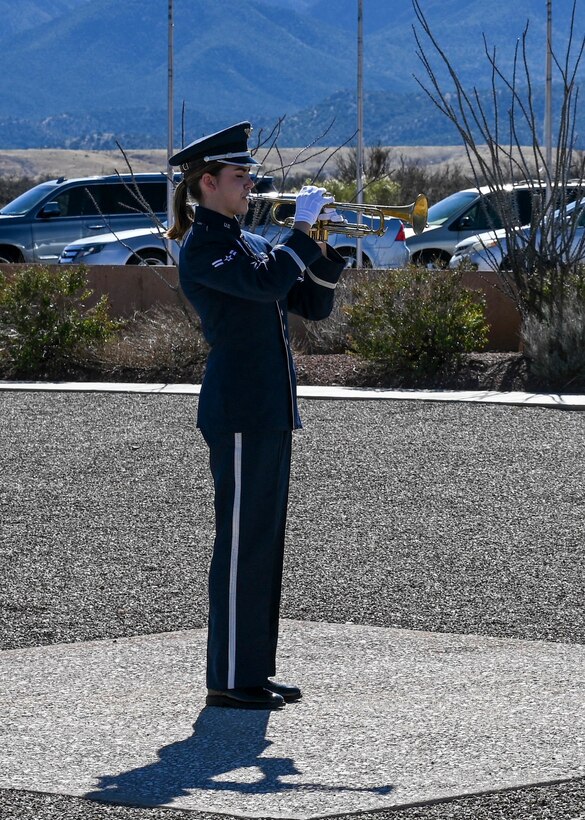 A1C Gilpatrick performs Taps