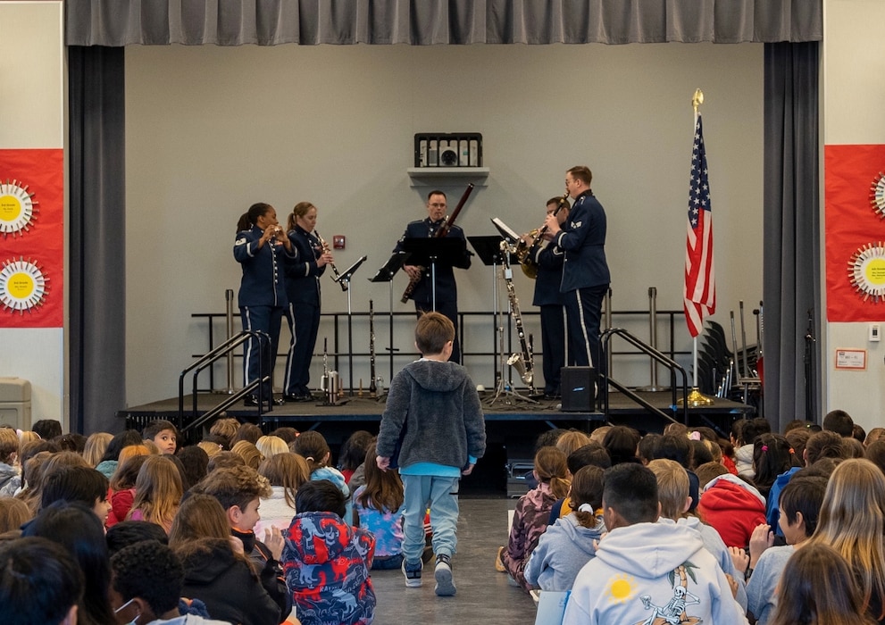The Golden West Winds perform for an elementary school in San Jose