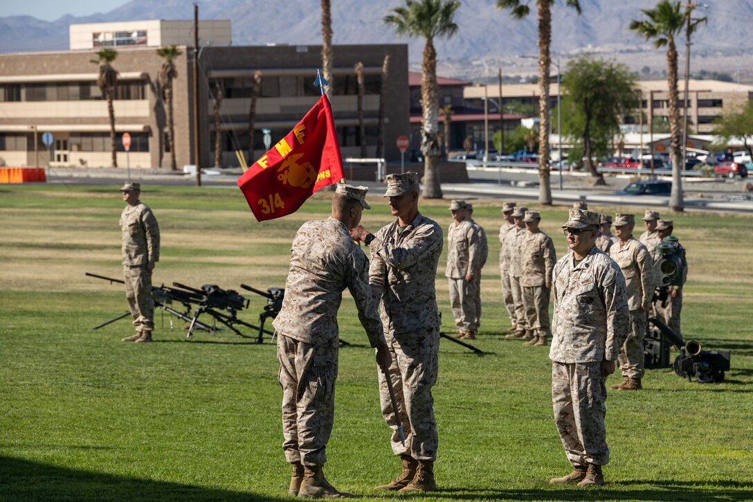 U.S. Marines with 3rd Battalion, 4th Marine Regiment retire the guidon during the unit’s deactivation ceremony at Marine Corps Air-Ground Combat Center, Twentynine Palms, California, June 1, 2023. Weapons Company Marines will integrate into and reinforce the battalion’s other existing rifle companies as part IBX-30. The battalion will continue fielding new equipment, testing new formations, and integrating new concepts across the unit to provide feedback to senior Marine Corps leadership, and inform the Service on the most lethal capabilities, training, and composition of future infantry battalions. (U.S. Marine Corps photo by Lance Cpl. Anna Higman)