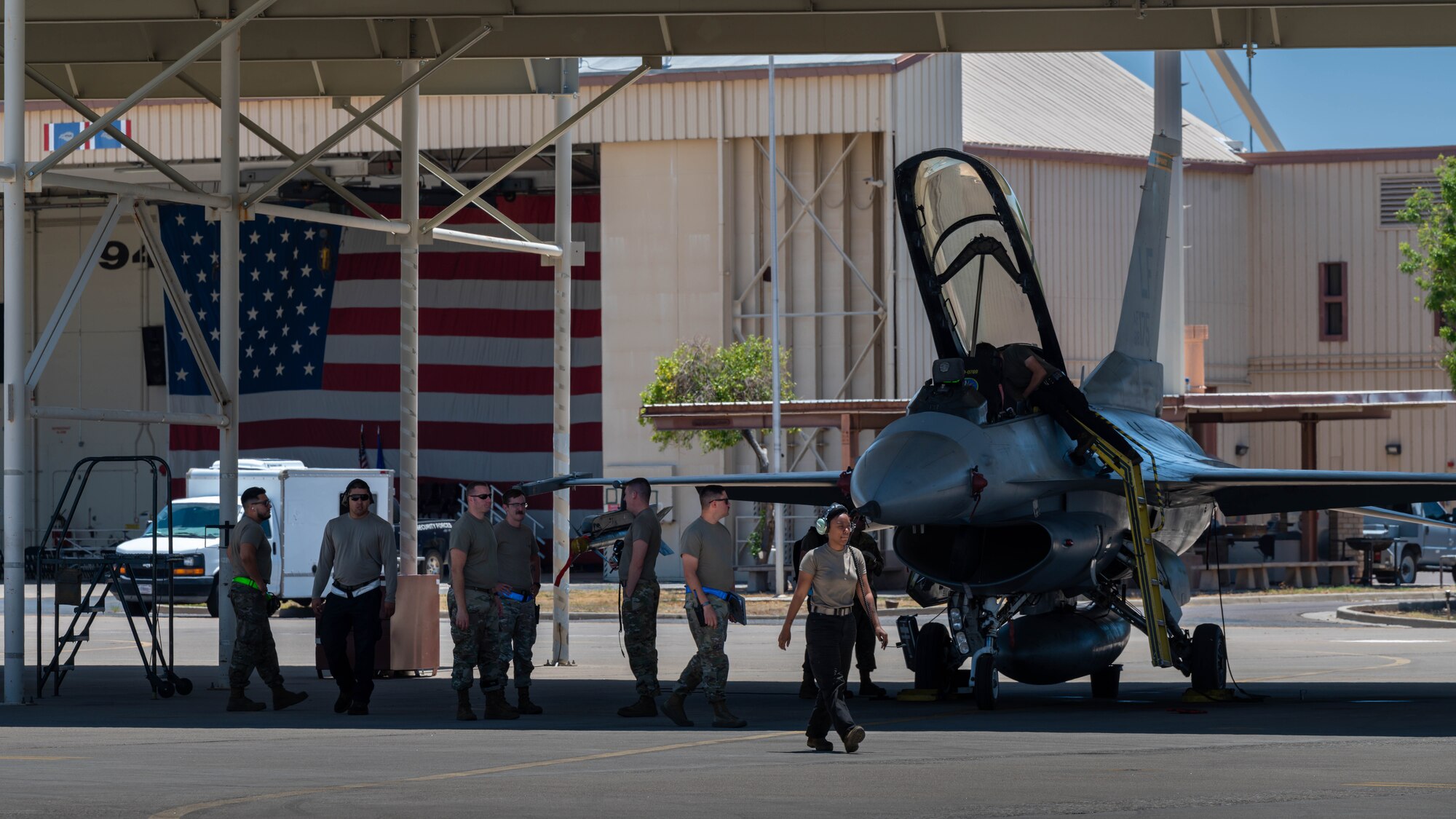 U.S. Air Force aircrew assigned to the 56th Fighter Wing, perform postflight checks on F-16 Fighting Falcons after an Instructor Pilot War Day exercise, June 23, 2023, at Luke Air Force Base, Arizona.