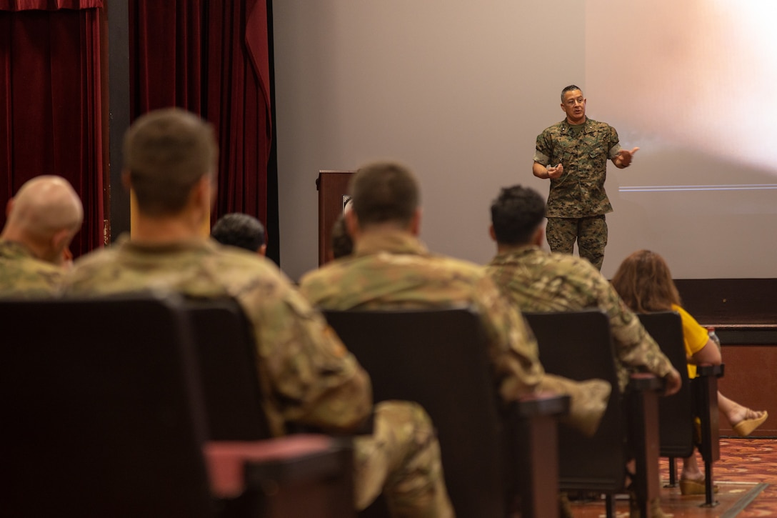 U.S. Marine Corps Brig. Gen. Adam L. Chalkley, commanding general for 3d Marine Logistics Group, speaks to service members occupying the EOD field, Marine Corps Air Station Kaneohe Bay, Marine Corps Base Hawaii, 6 June, 2023. The U.S. Marine Corps hosted the annual Joint EOD Symposium for 2023 to streamline current processes and constructs and discuss future capabilities throughout the Department of Defense. (U.S. Marine Corps photo by Cpl. Logan Beeney)