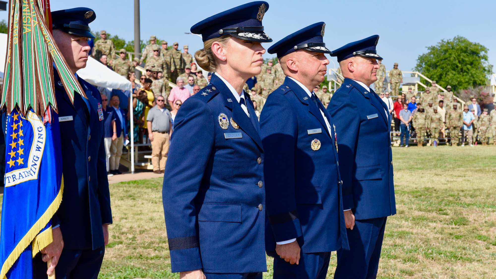 Maj. Gen. Michelle Edmondson, Second Air Force commander, Brig. Gen. George T.M. Dietrich III, 82nd Training Wing incoming commander, and Brig. Gen. Lyle Drew, 82nd TRW outgoing commander, stand at attention at the 82nd TRW Change of Command Ceremony at Sheppard Air Force Base, Texas, June 26, 2022.
