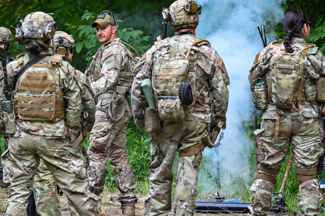 Tech. Sgt. Anthony McDaniel, an Integrated Defense Leadership Course cadre member assigned to the 914th Security Forces Squadron, Niagara Falls Air Reserve Station, New York, demonstrates how an early warning device works on June 15, 2023, at Camp James A. Garfield Joint Military Training Center, Ohio.