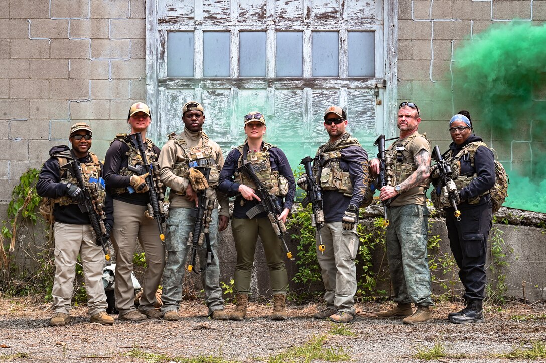 Defenders assigned to the 301st Security Forces Squadron, Carswell Field, Naval Air Station Joint Reserve Base Fort Worth, Texas, and the 916th SFS, Seymour Johnson Air Force Base, North Carolina, pose for a photo after a training exercise on June 15, 2023, at Camp James A. Garfield Joint Military Training Center, Ohio.