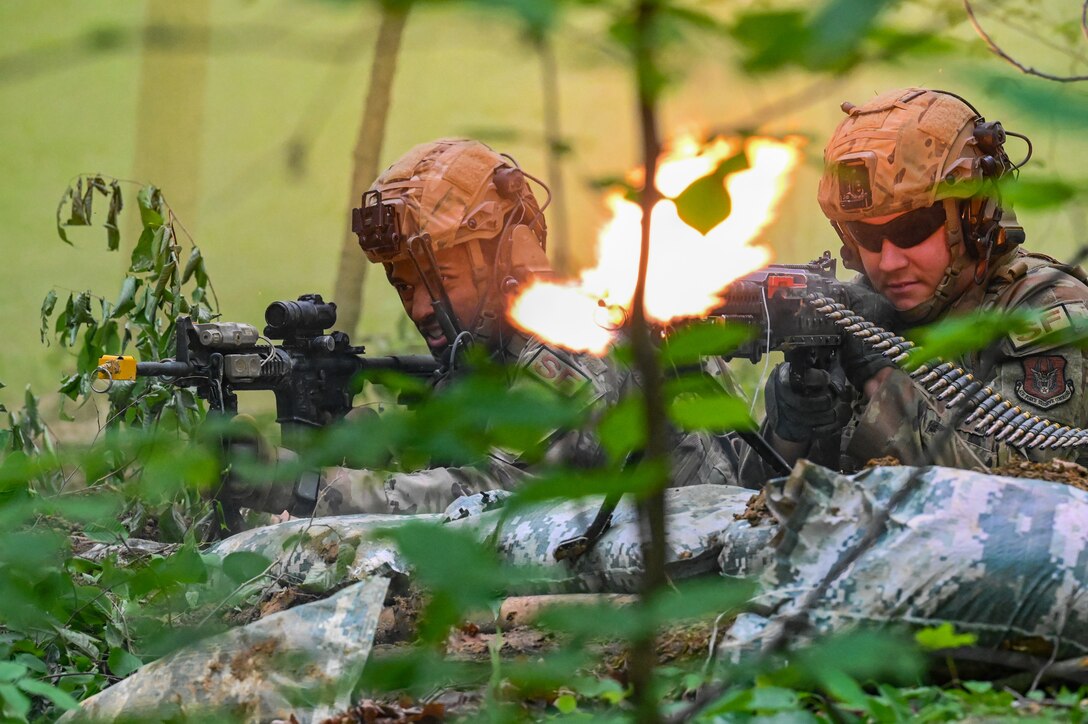 Defenders assigned to the 301st Security Forces Squadron, Carswell Field, Naval Air Station Joint Reserve Base Fort Worth, Texas, fire the M4 carbine and M249 light machine gun during a training exercise on June 15, 2023, at Camp James A. Garfield Joint Military Training Center, Ohio.