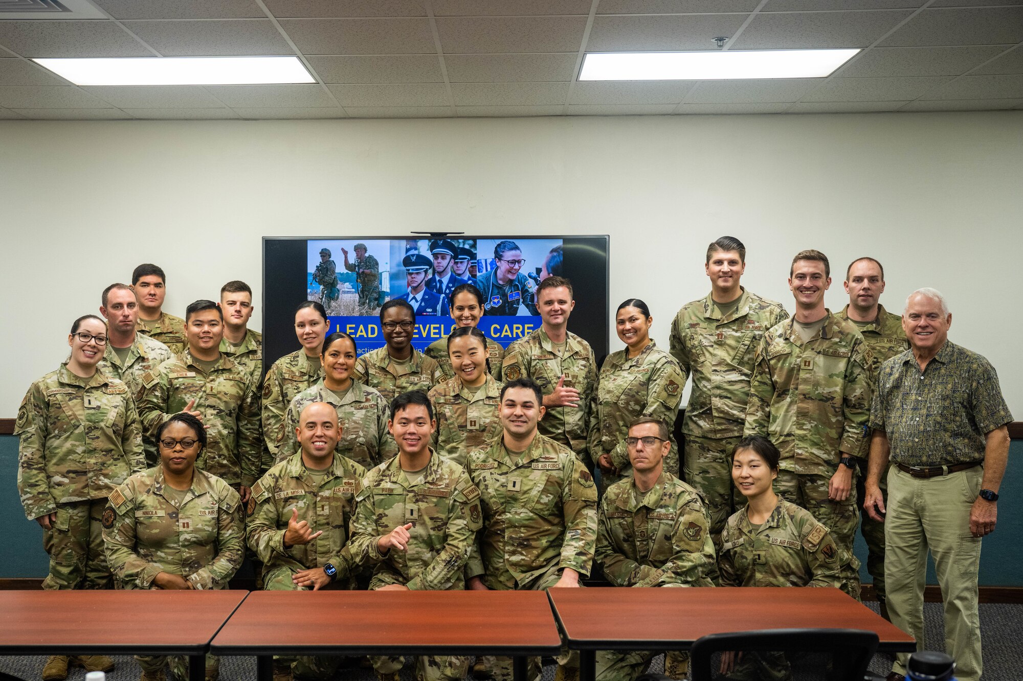 Company grade officers assigned to Joint Base Pearl Harbor-Hickam pose for a group photo during a leadership development course at Joint Base Pearl Harbor-Hickam, Hawaii, June 21, 2023. This training was designed to showcase leadership through the lead, develop and care model, focusing on the areas of leader development, strategy and innovation. (U.S. Air Force photo by Senior Airman Makensie Cooper)